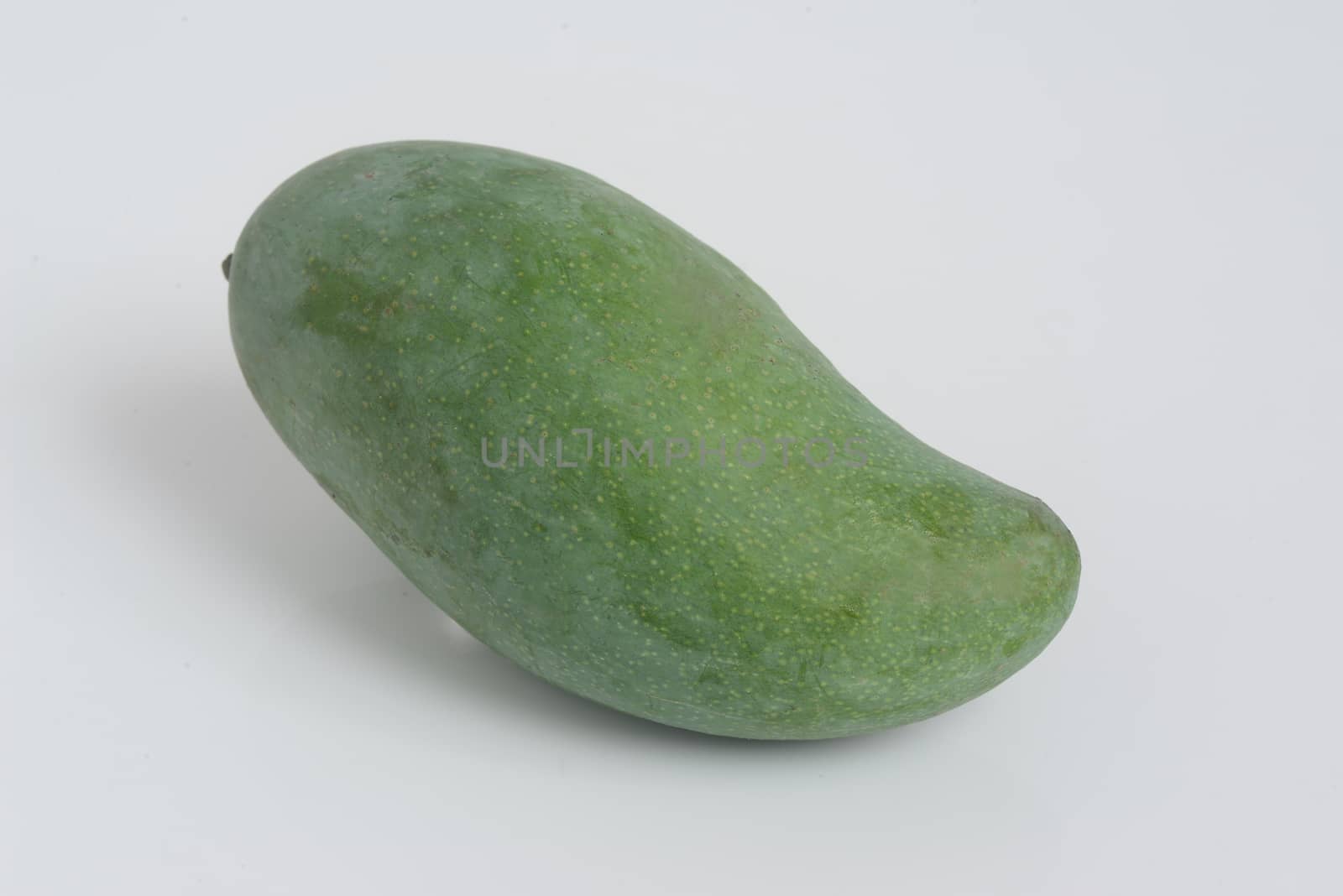 Fresh green mango fruit on white background by ideation90