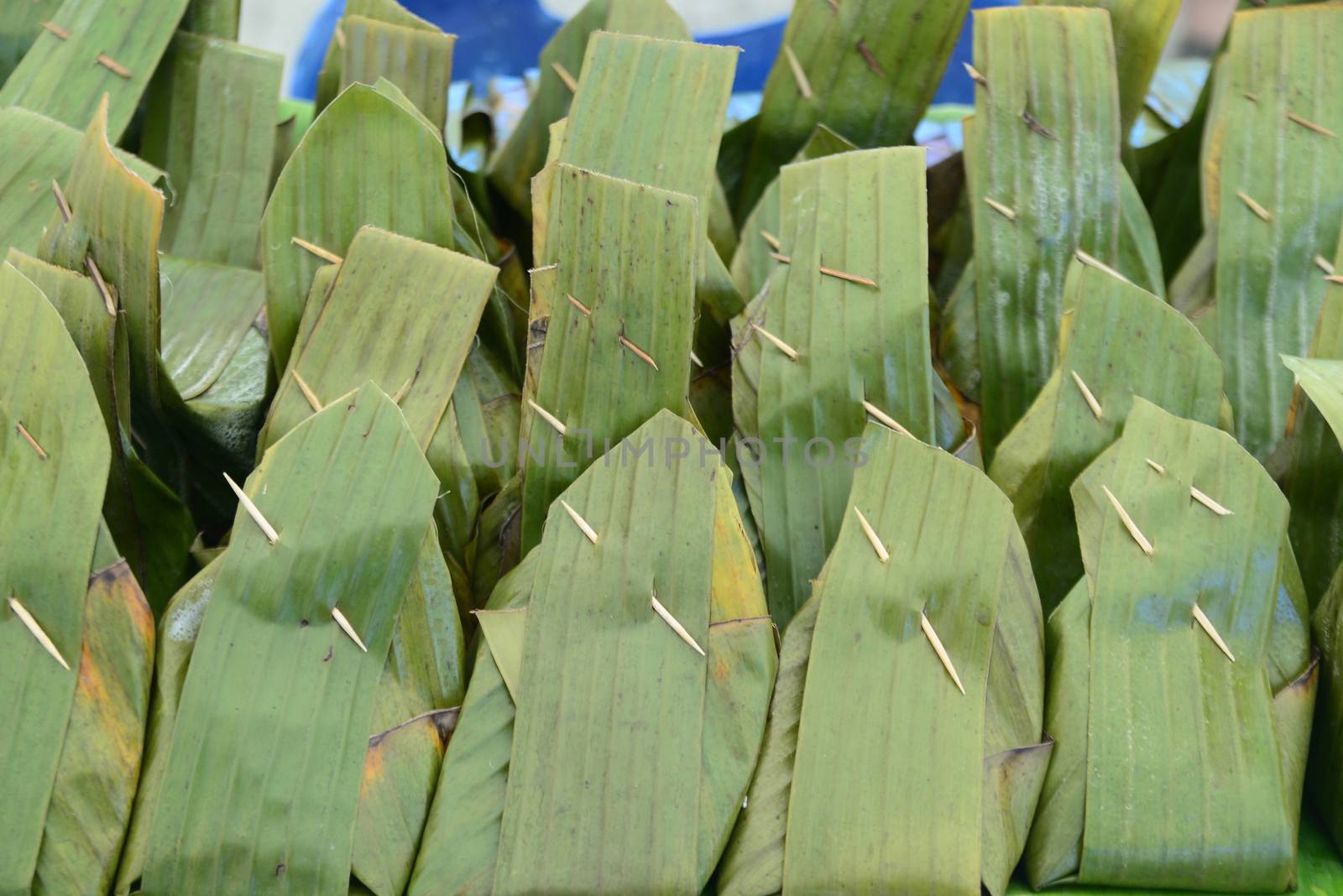 banana leaf package food, note  select focus with shallow depth of field	
