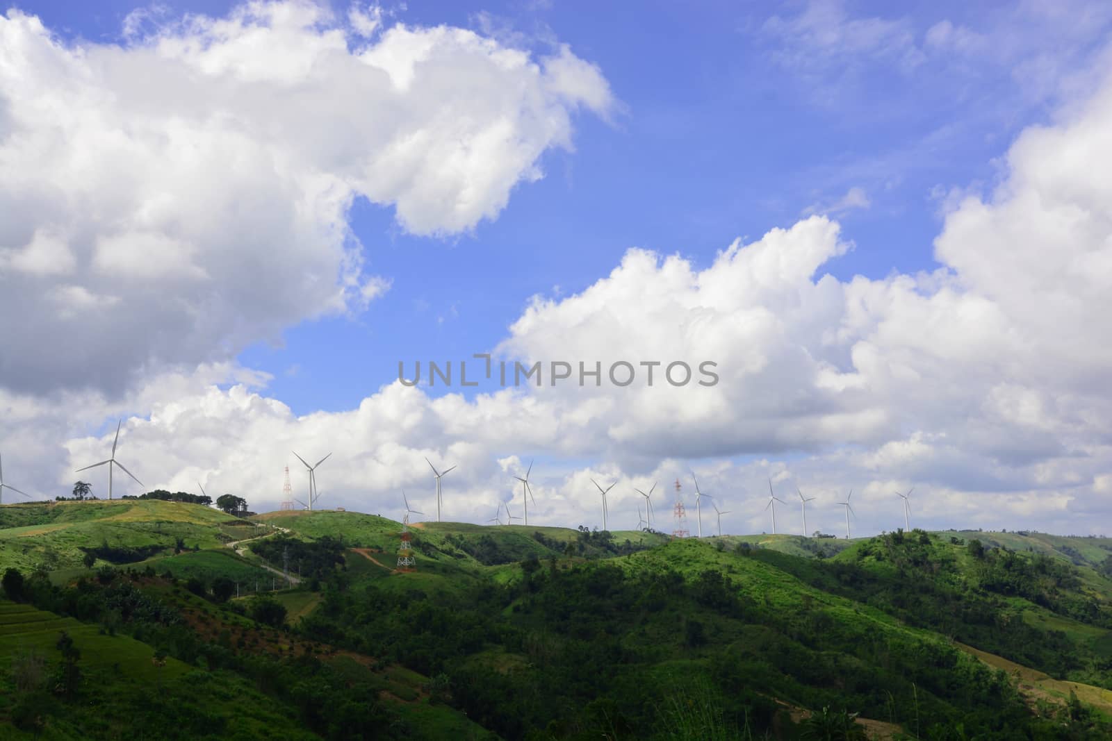 Wind turbine renewable energy source summer on the hill