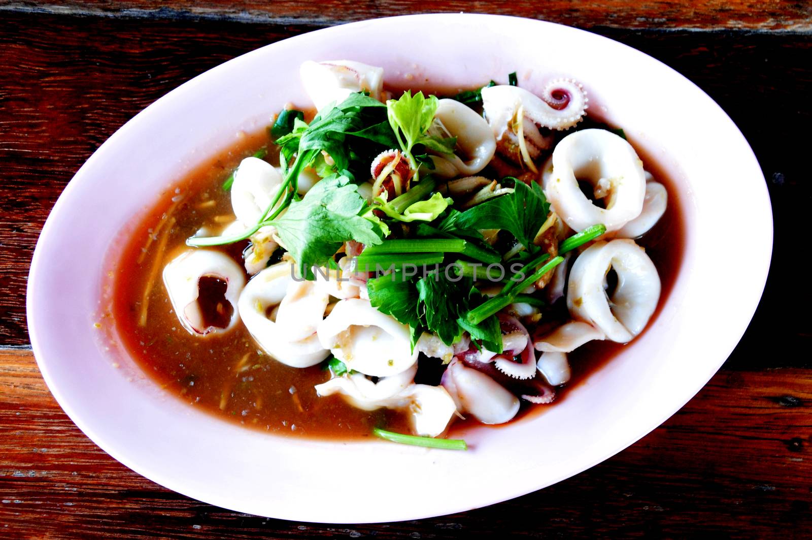 Stewed squid rings in sauce by ideation90