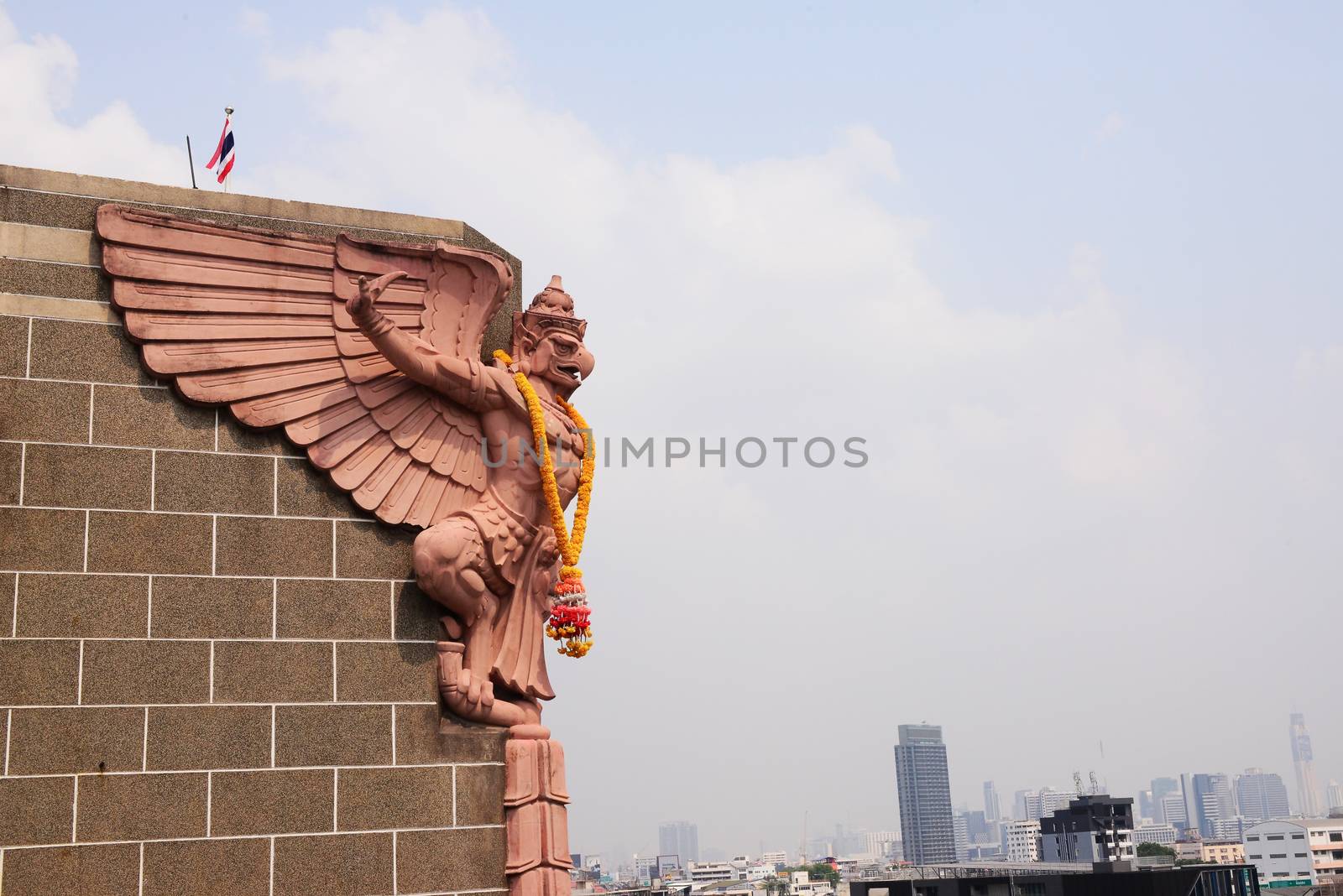 Soft focus of Big Garuda statue on public skyscraper by ideation90