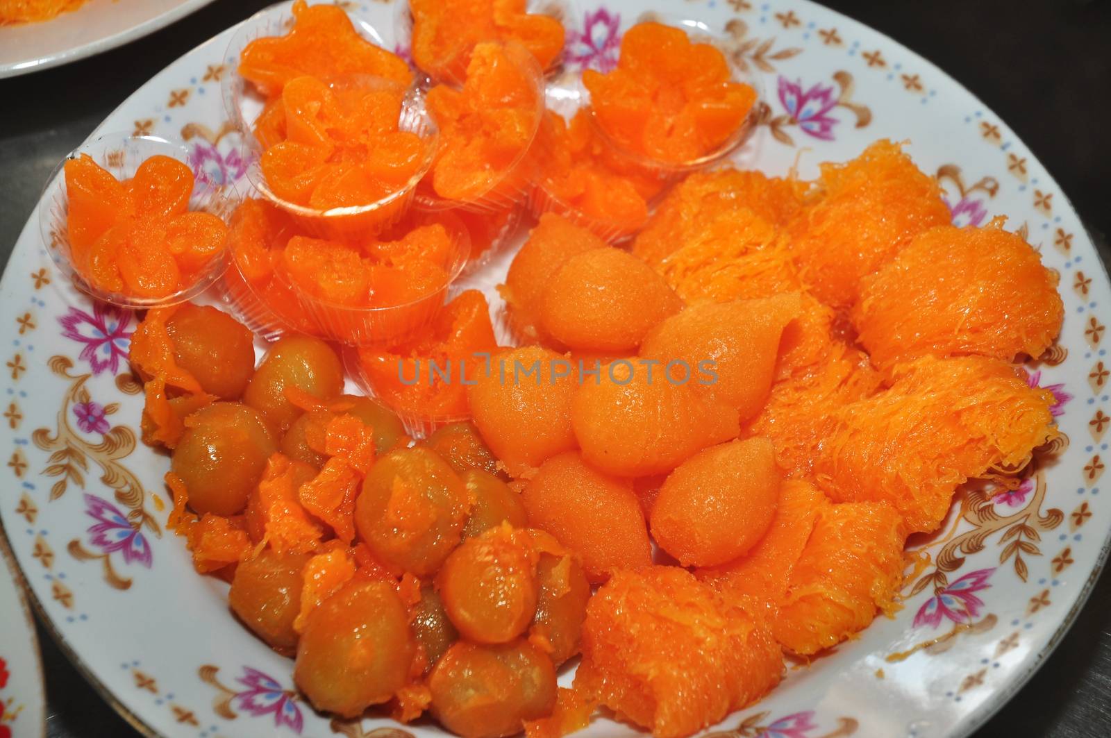 golden drops (thong yot ), golden flowers (thong yip) and golden threads (foi thong ) is made from egg yolks, flour and sugar and Thai Mung Bean Marzipan and Egg Yolk Dessert Recipe (Met Khanoon)