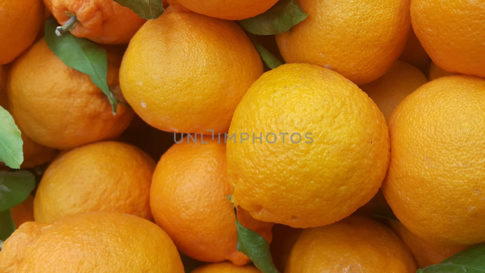 Healthy, fresh organic oranges in supermarket for sale, pile of orange in market for texture