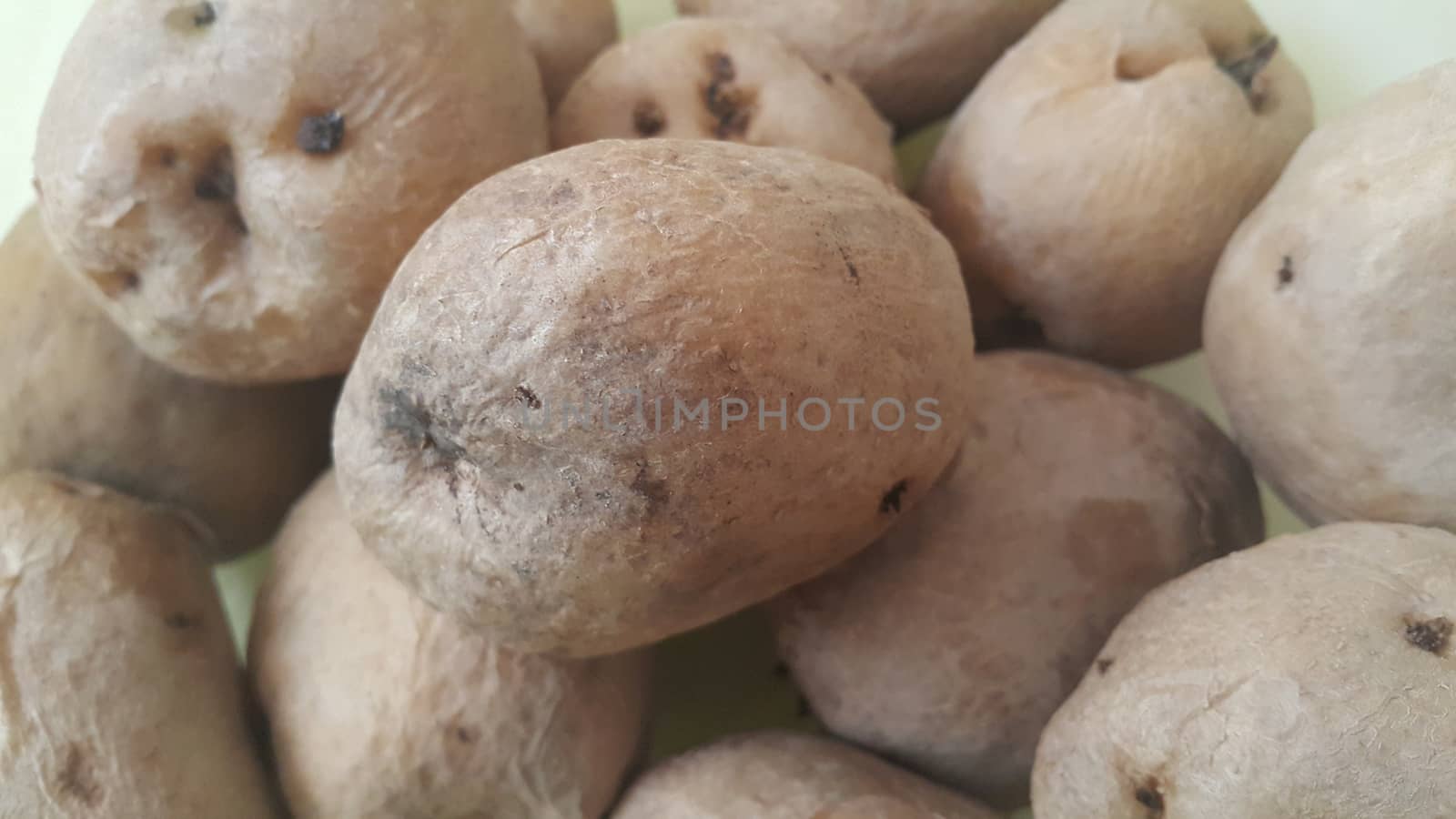  close up view of fresh organic potato in market:  Food background texture of raw potatoes