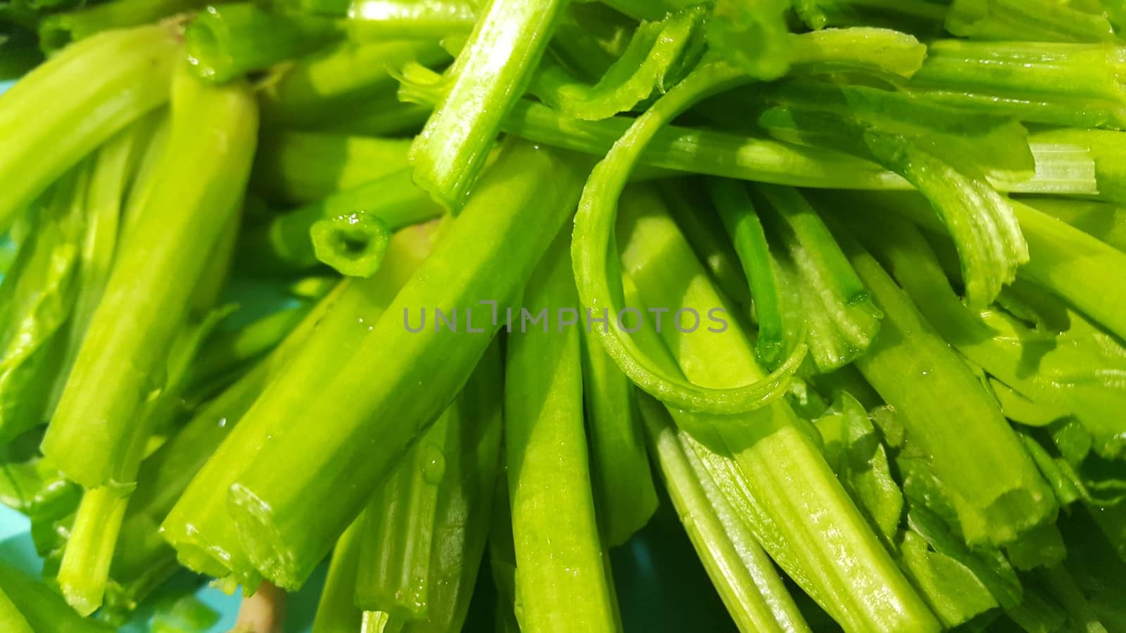 Close up view of lush green leaves base of spinach or paalak saag  by Photochowk