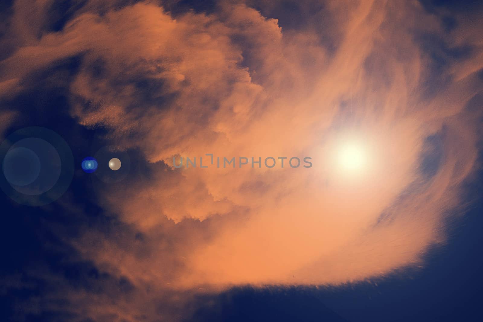 Sky with sunlight in orange shade and dark blue sky background, digital illustration