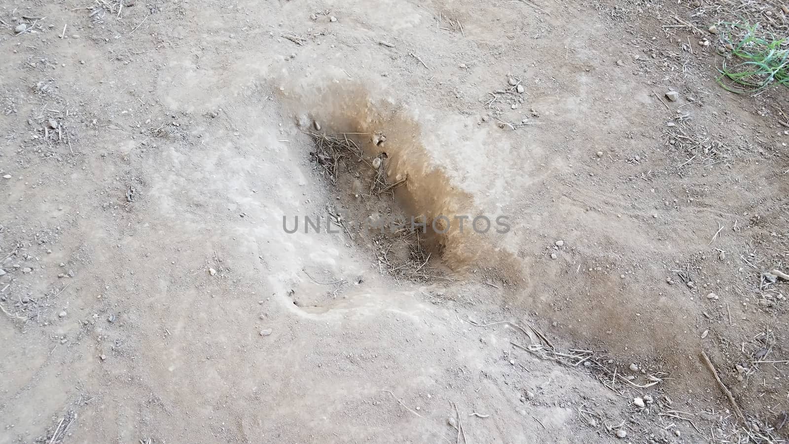 mud or dirt with holes in the ground by stockphotofan1