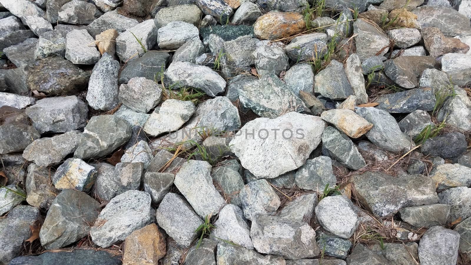 pile of grey rocks or stones or boulders or background