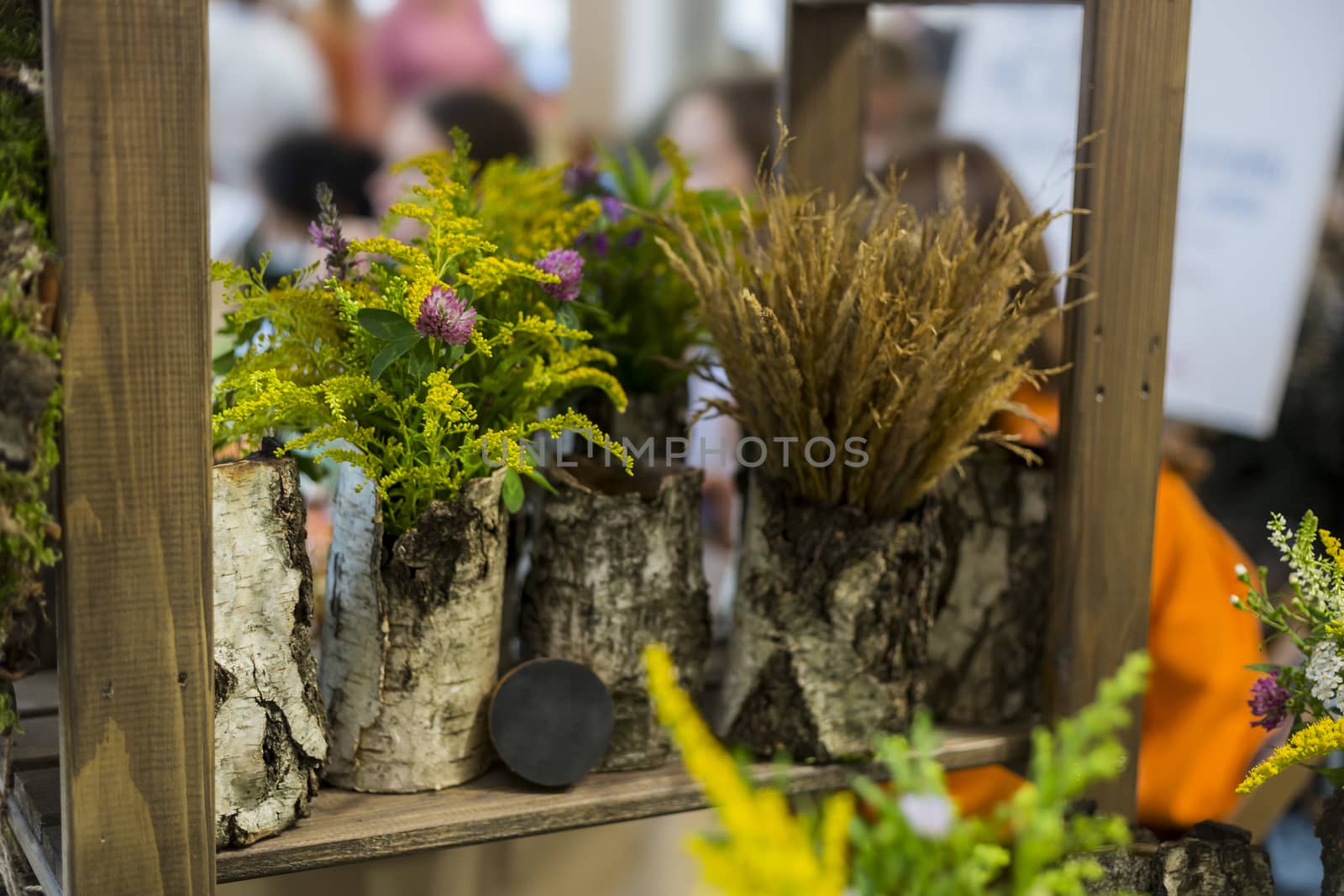 Bouquet of wildflowers in a bark vase, eco-friendly interior decoration by galinasharapova