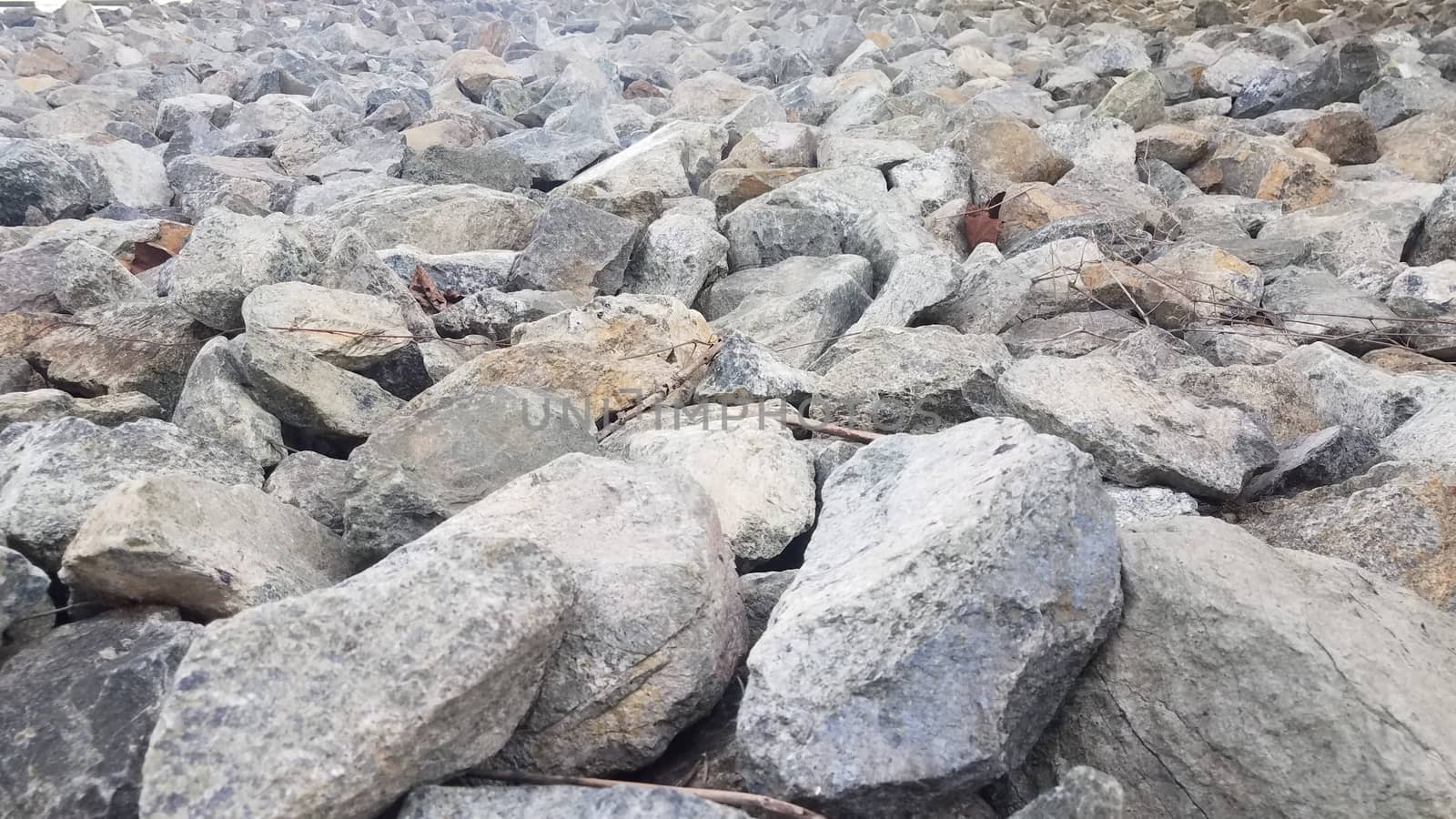 pile of grey rocks or stones or boulders or background