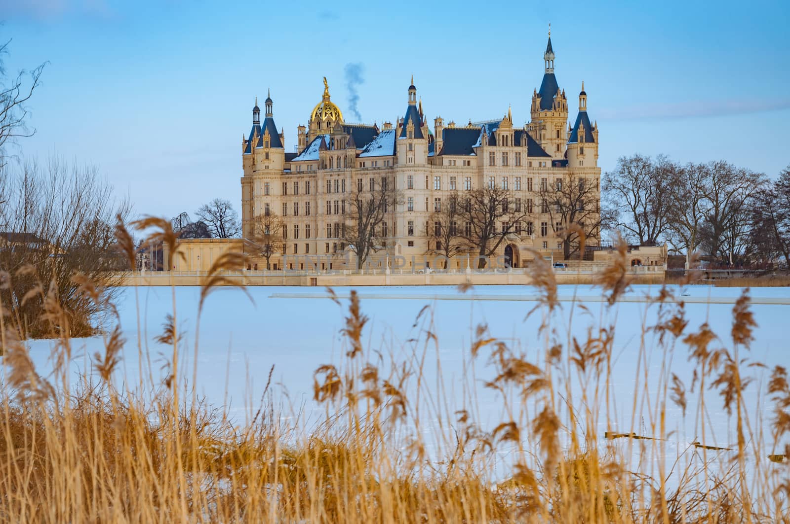 The beautiful, fairy-tale Castle of Schwerin in winter times by Fischeron