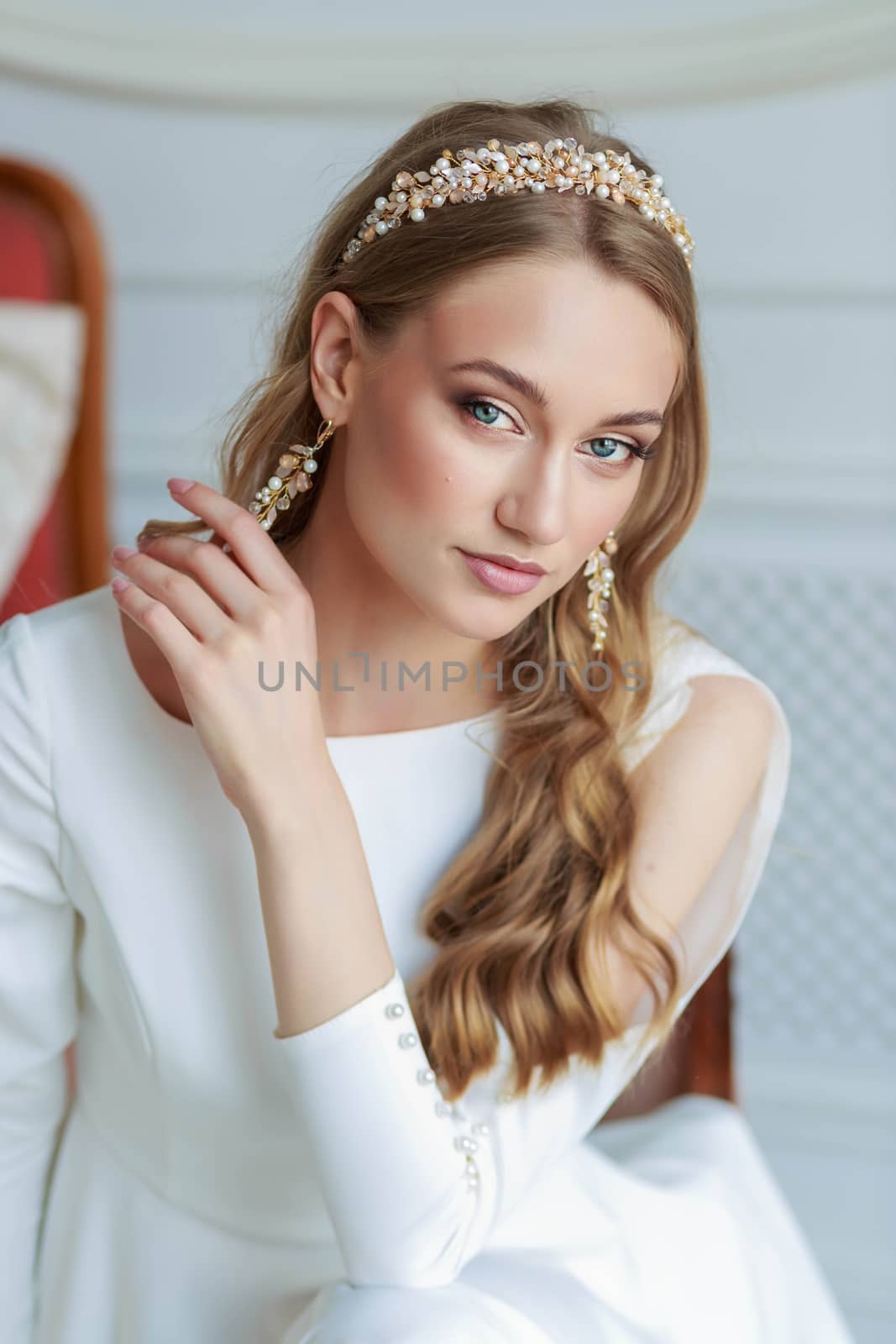 Close-up portrait of the bride in a beautiful white wedding dress.