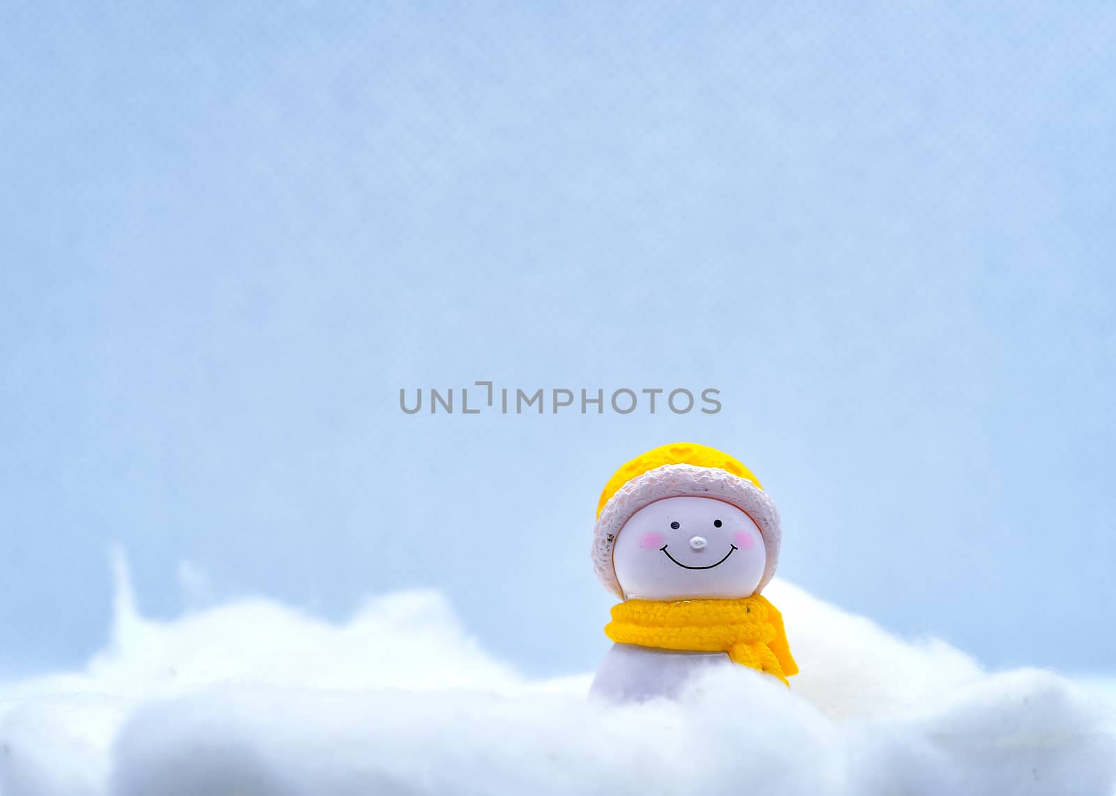 Tourism and travel concept: Miniature little snowman standing alone by rkbalaji