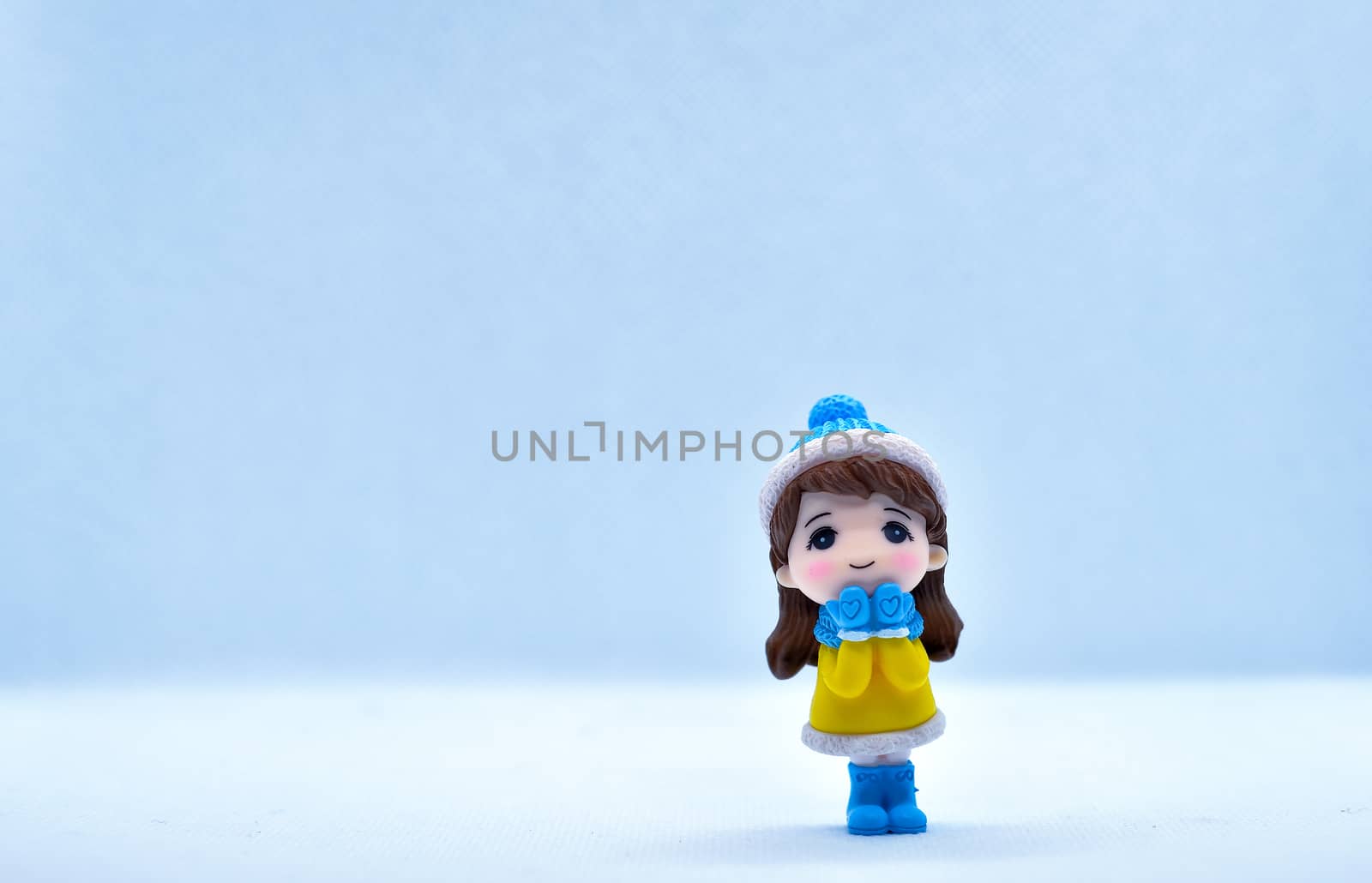 Tourism and travel concept: Miniature little girl standing in isolated background