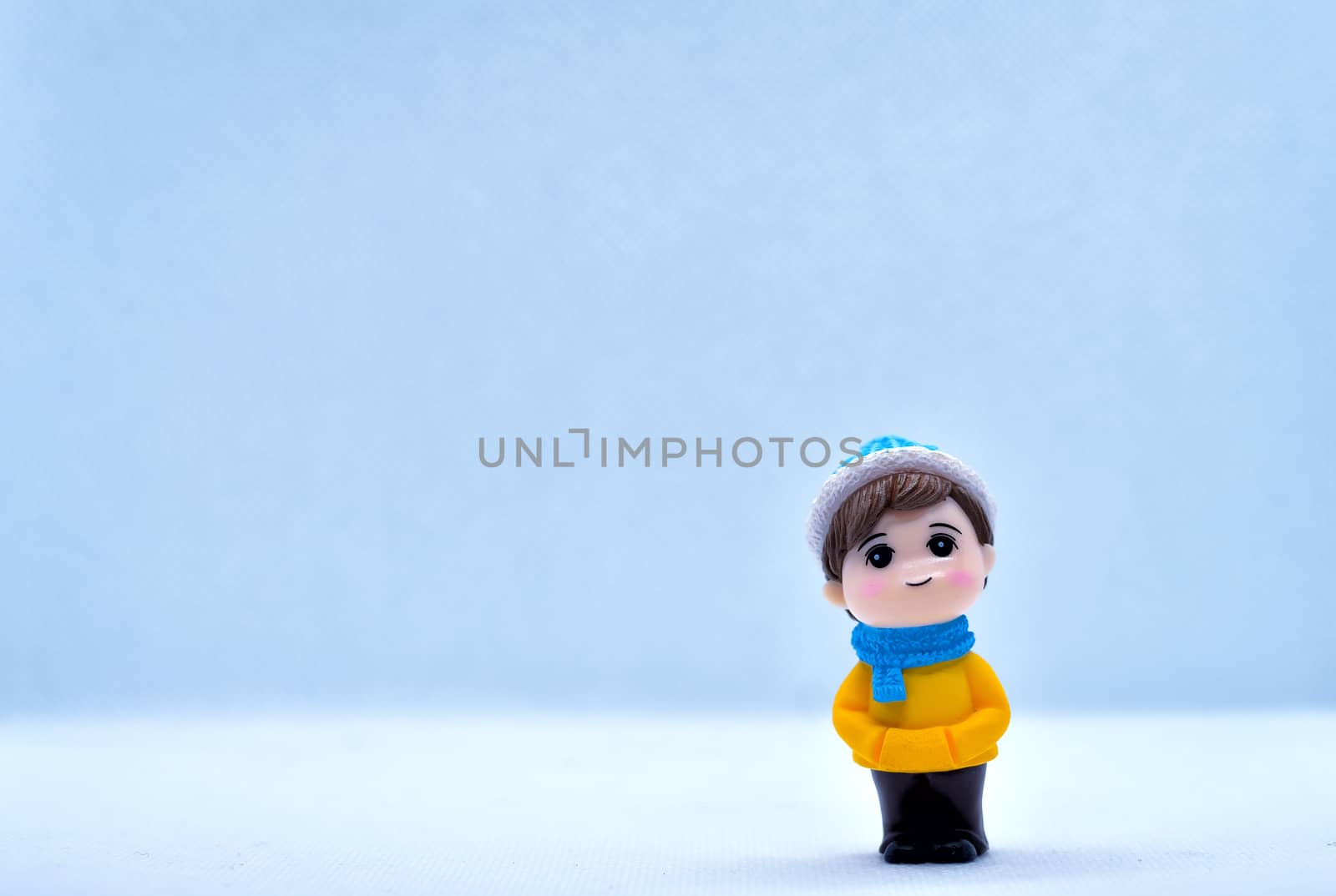 Tourism and travel concept: Miniature little boy standing in isolated background by rkbalaji