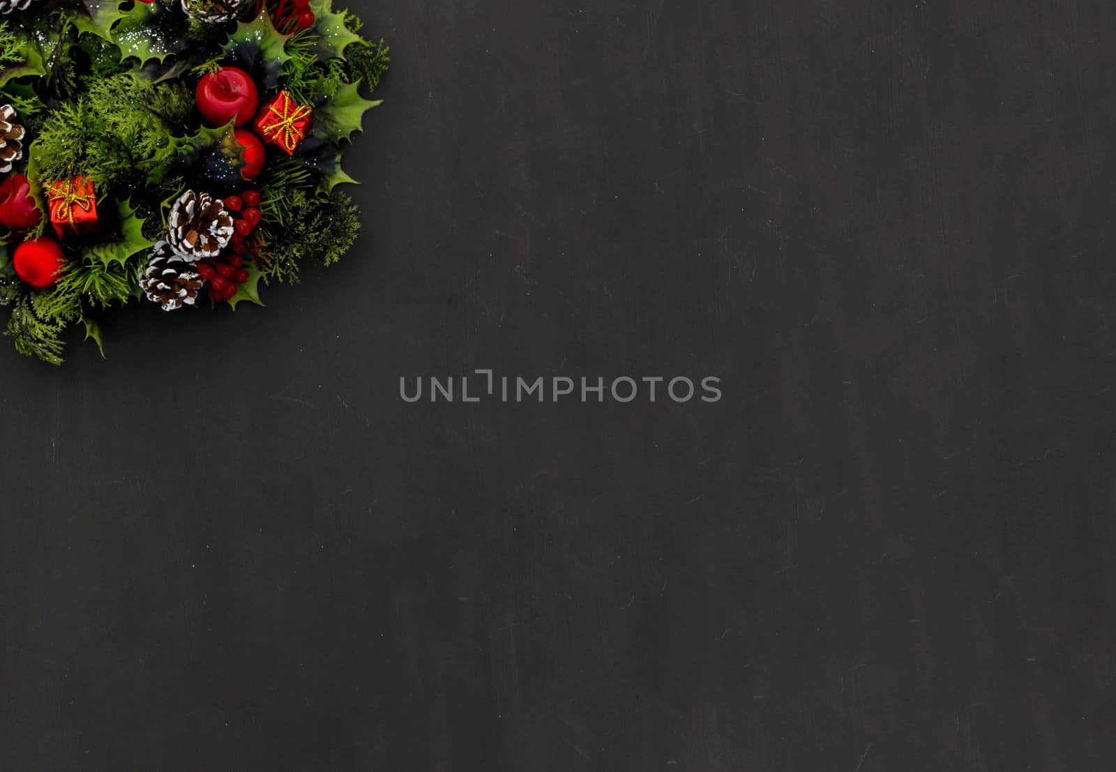 New year background christmas wreath on dark chalk board