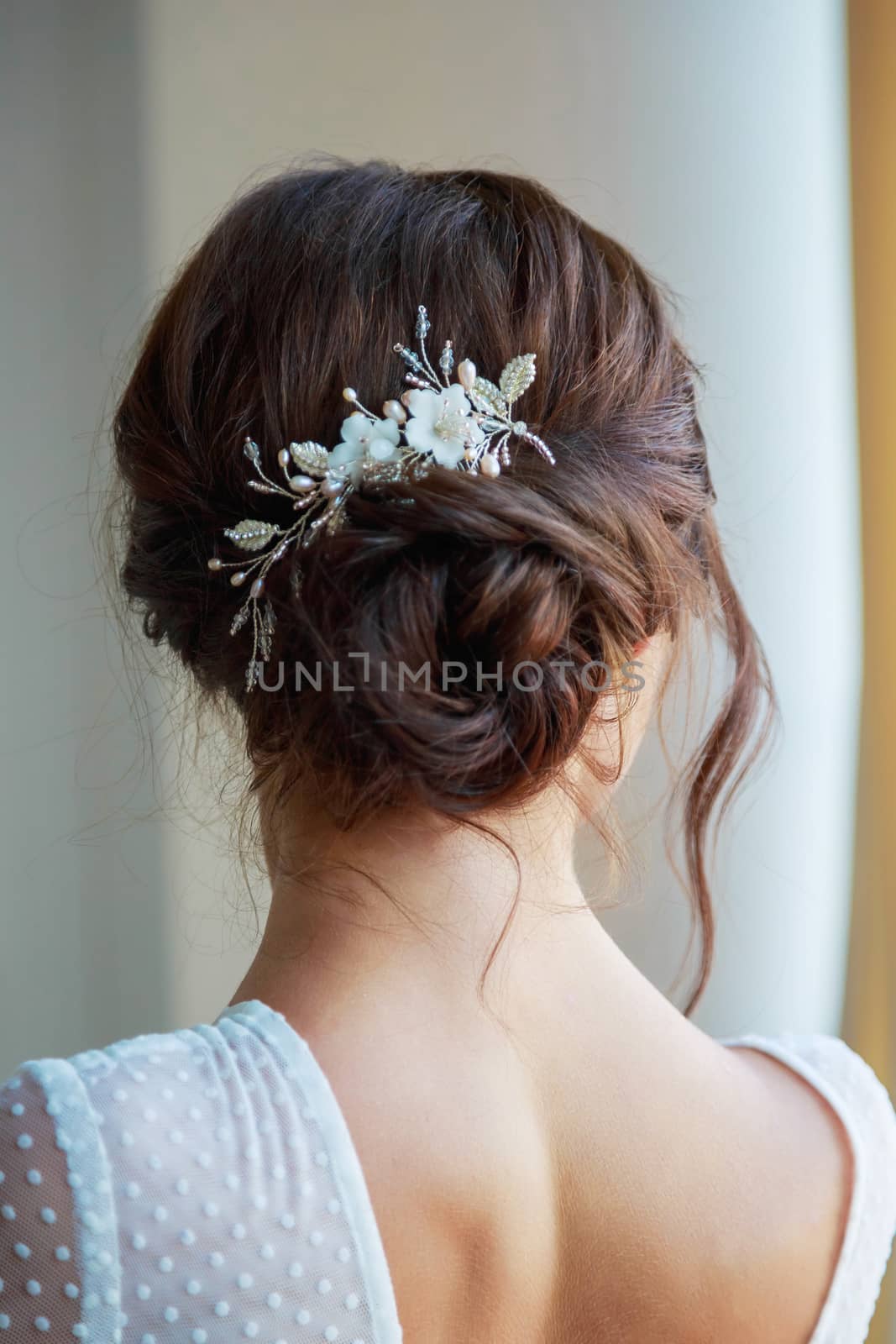 Close-up of a beautyful wedding hairstyle with hair decoration.