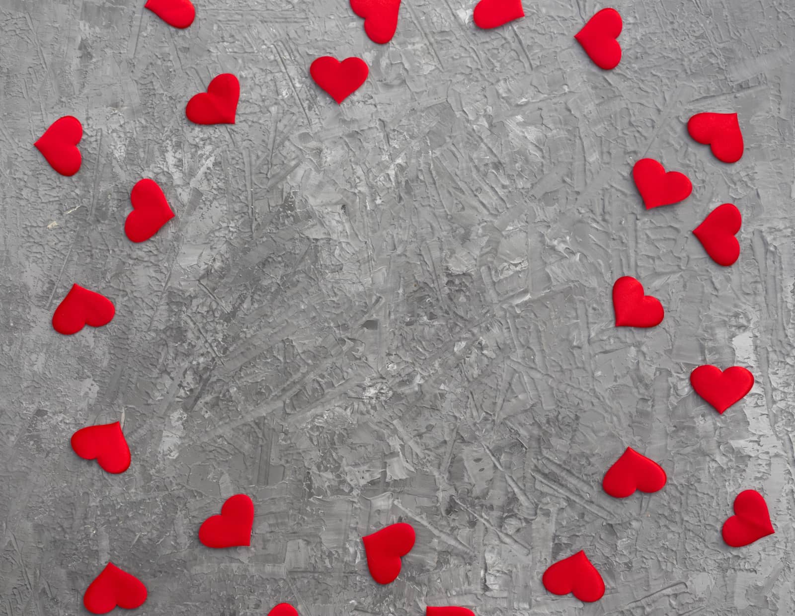 Romantic background with red hearts on concrete. by galinasharapova