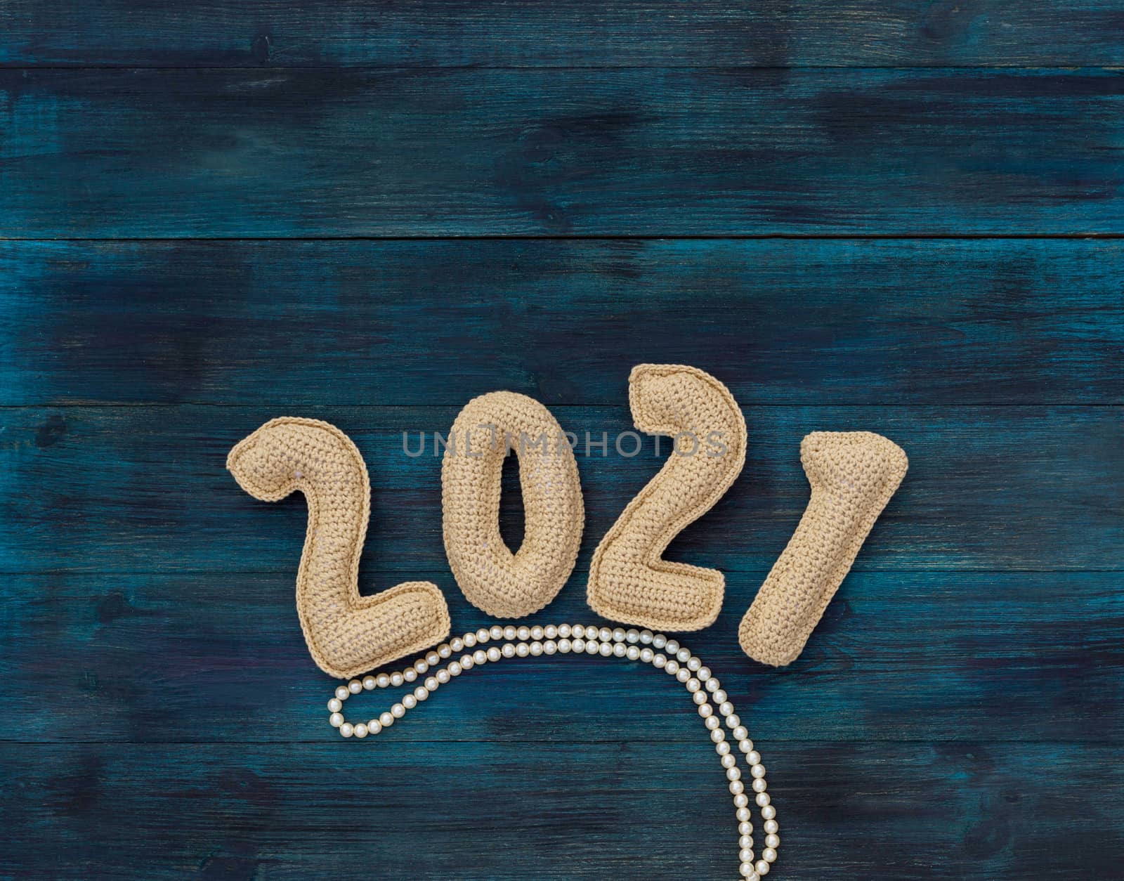 Christmas background with chroched 2021 number with copy space top view by galinasharapova