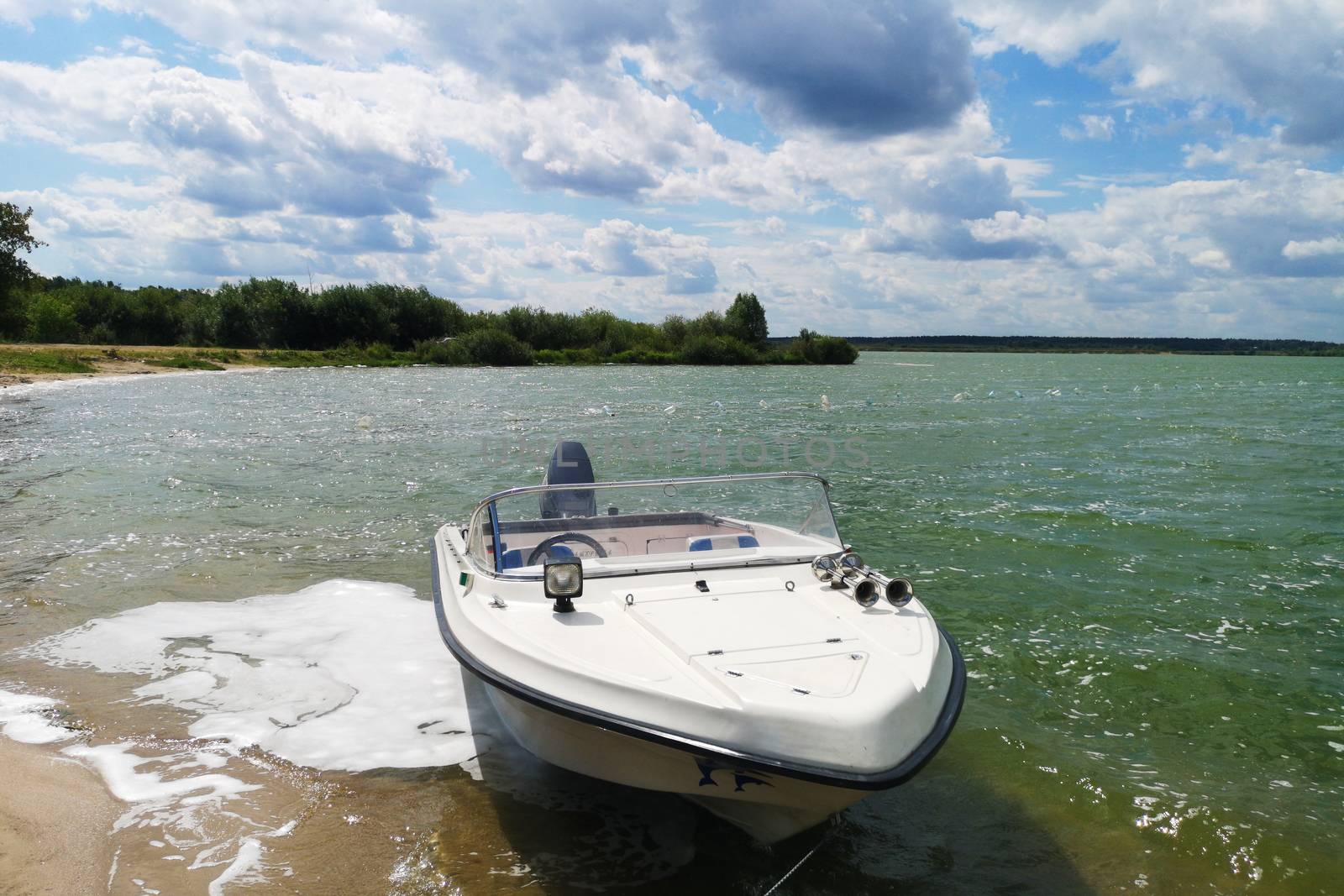 White motor boat motorboat stands near the shore of the lake  by galinasharapova