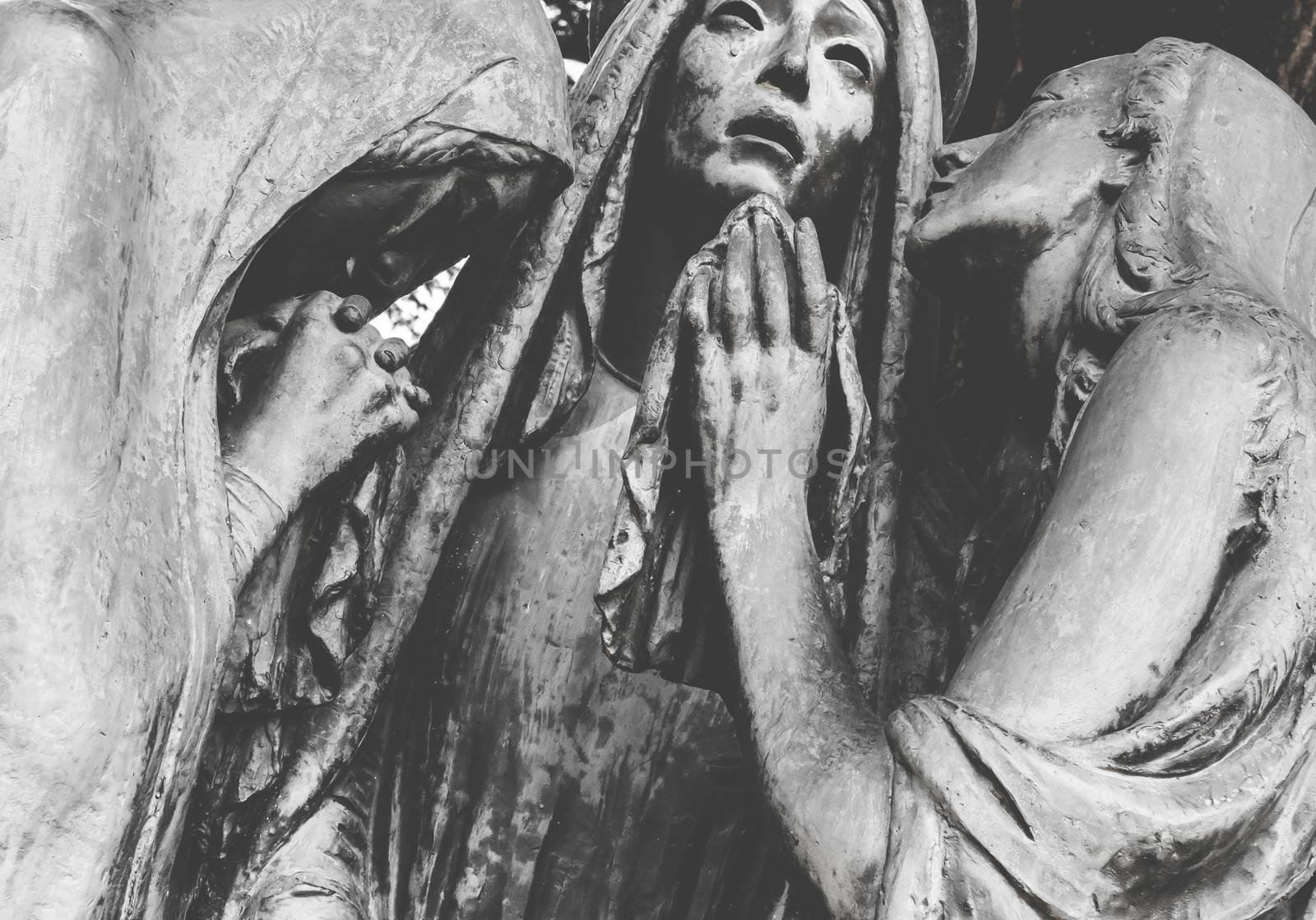 Statue of the three desperate Marys. Retro style photo.