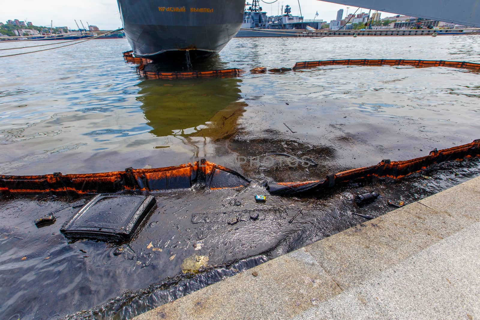 Environmental disaster. Spill of oil products into the sea. Dirty water area of the Golden Horn Bay in Vladivostok