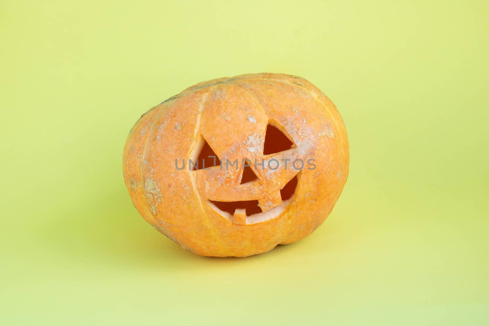 Funny pumpkin on a yellow background.The concept of Halloween by lapushka62