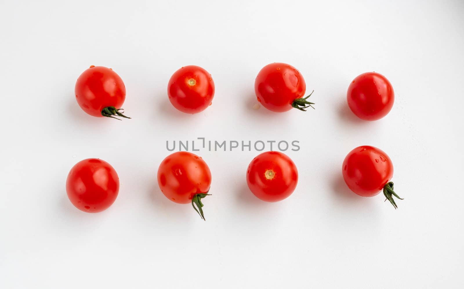 Cherry tomatoes isolated on a white background. The view from the top. the concept of harvest by lapushka62