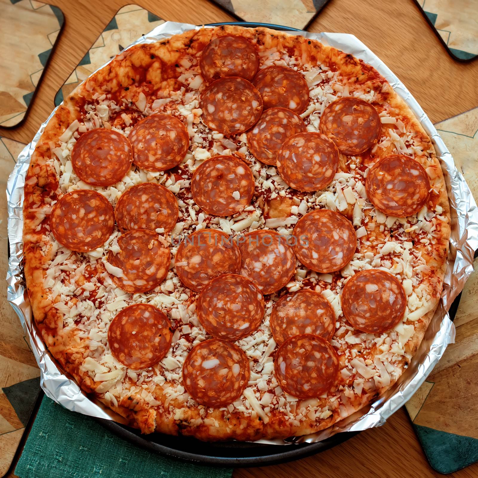 pizza with salami on a table