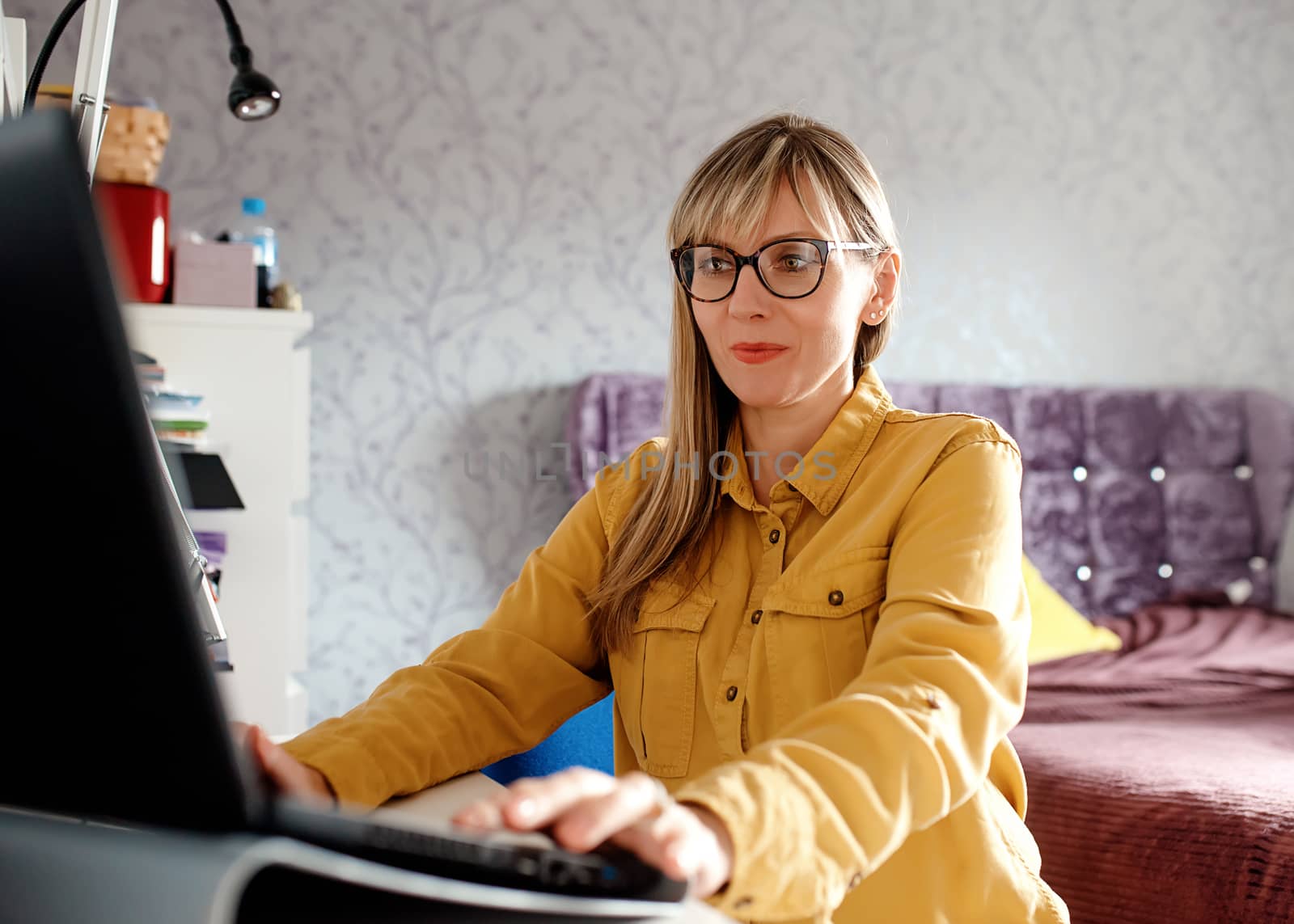 businesswoman working on laptop at home