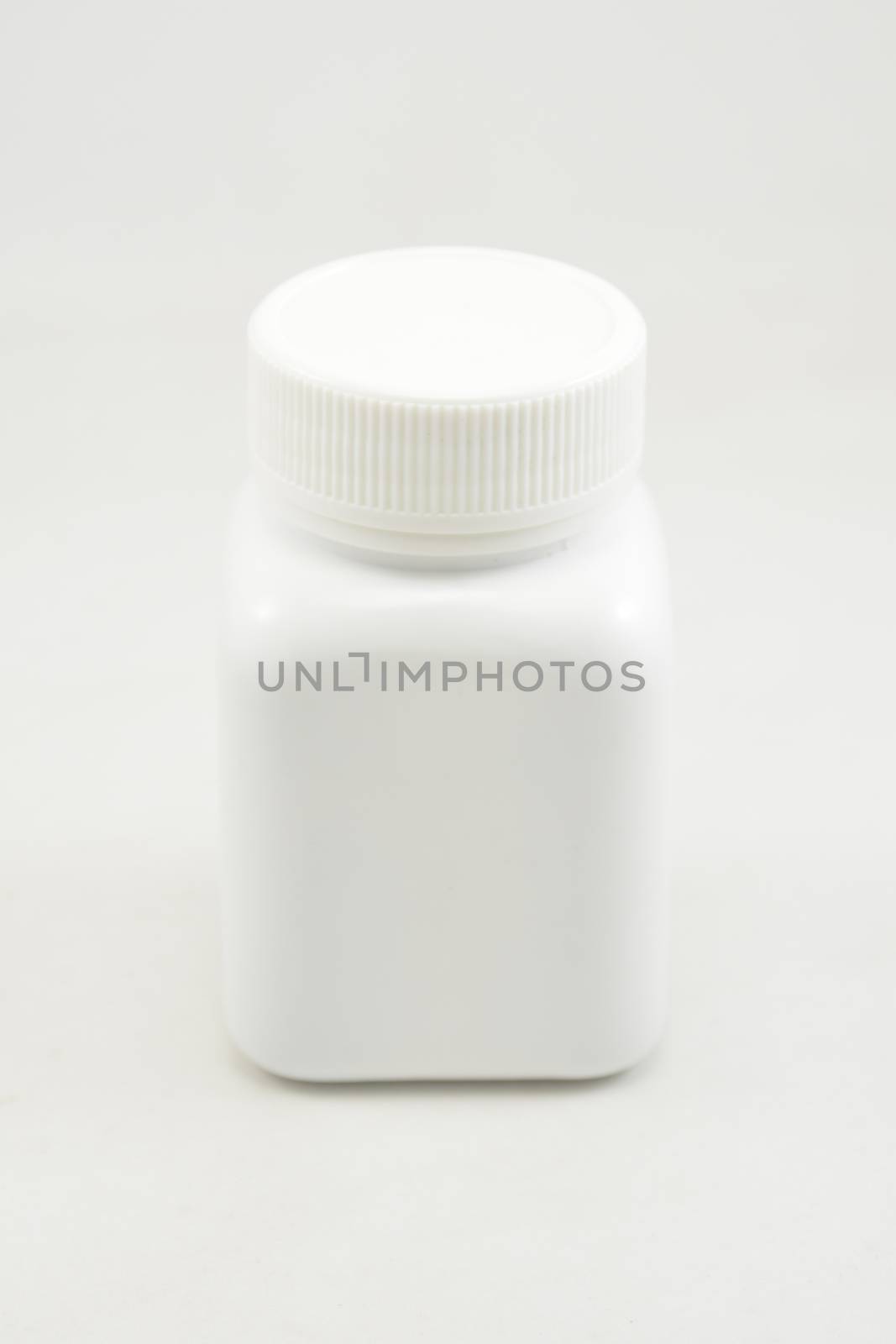 White plastic bottle container with screw cap use to put medicine tablet or capsule