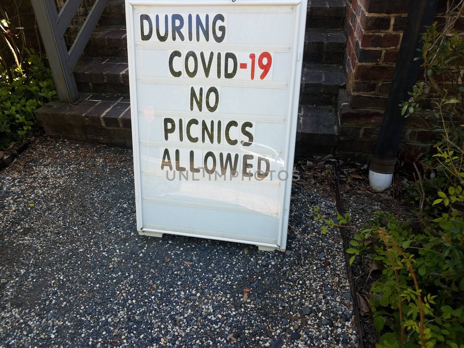 during covid 19 no picnics allowed sign on rocks by stockphotofan1