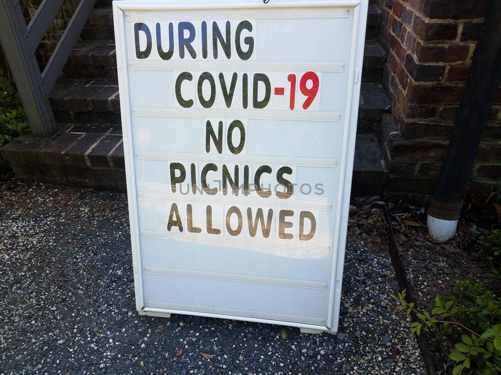 during covid 19 no picnics allowed sign on rocks or stones