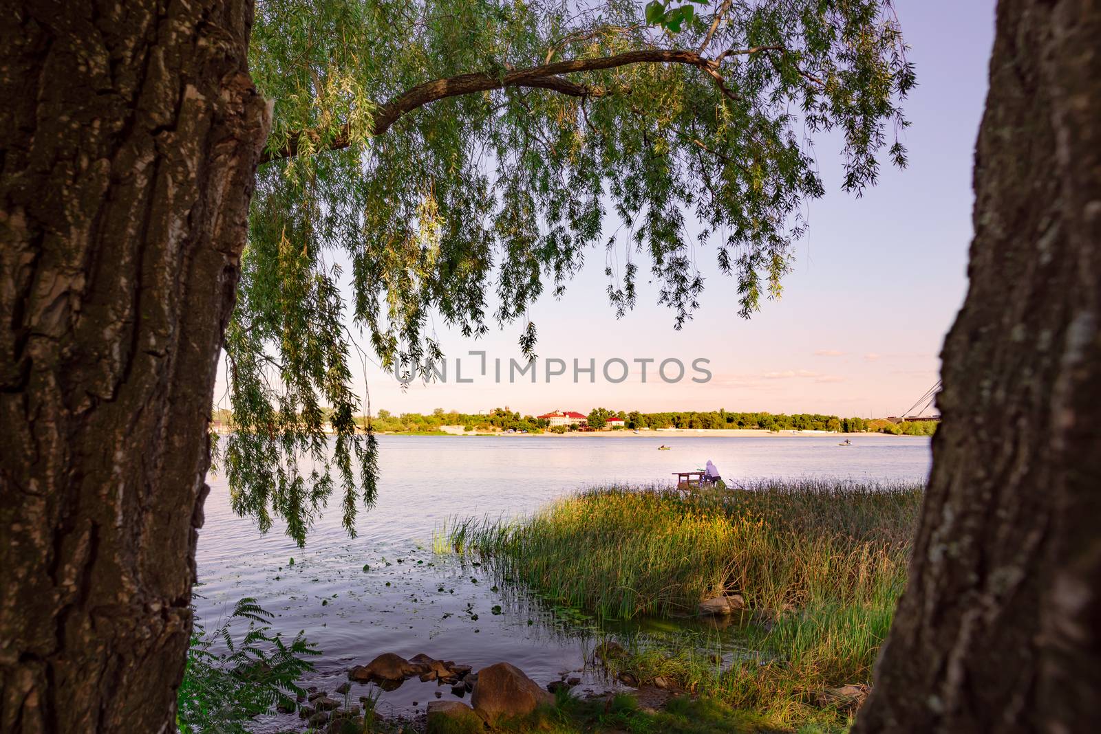 Fisherman on the Dnieper River in Kiev, Ukraine by MaxalTamor