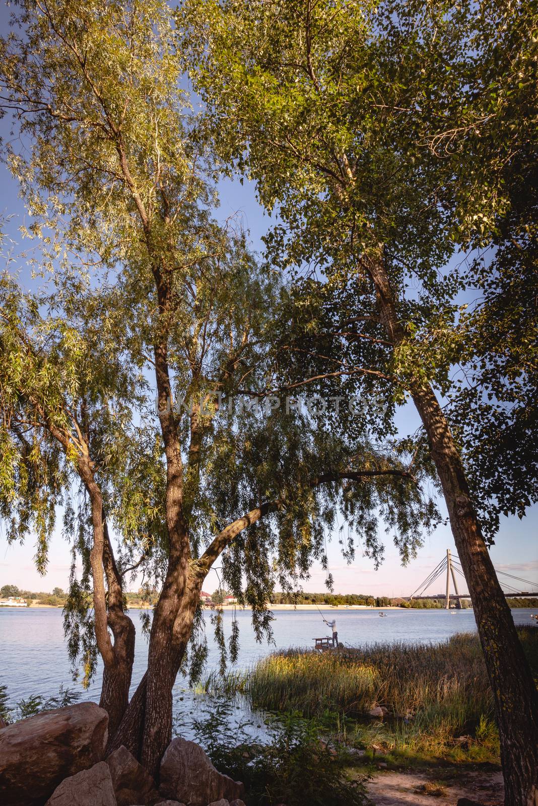 Kiev / Ukraine - September 11, 2020 - Fisherman on the Dnieper River in Kiev, Ukraine during a nice sunny afternoon of summer