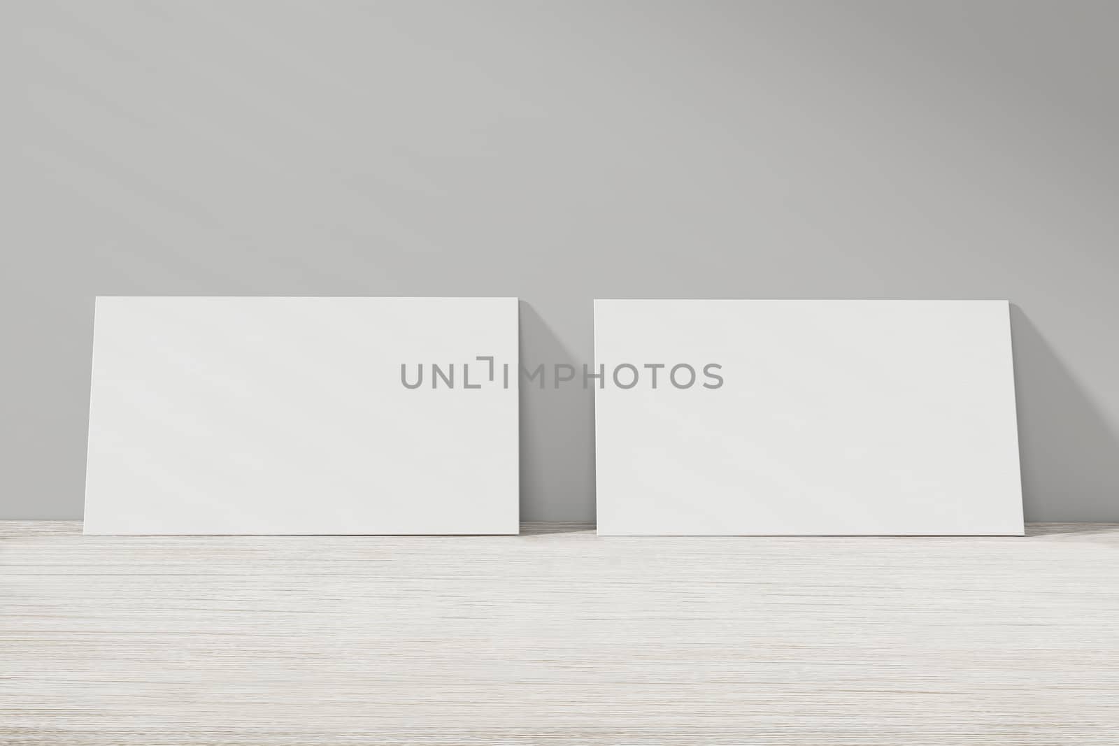 Mockup of two horizontal business cards at white textured background.