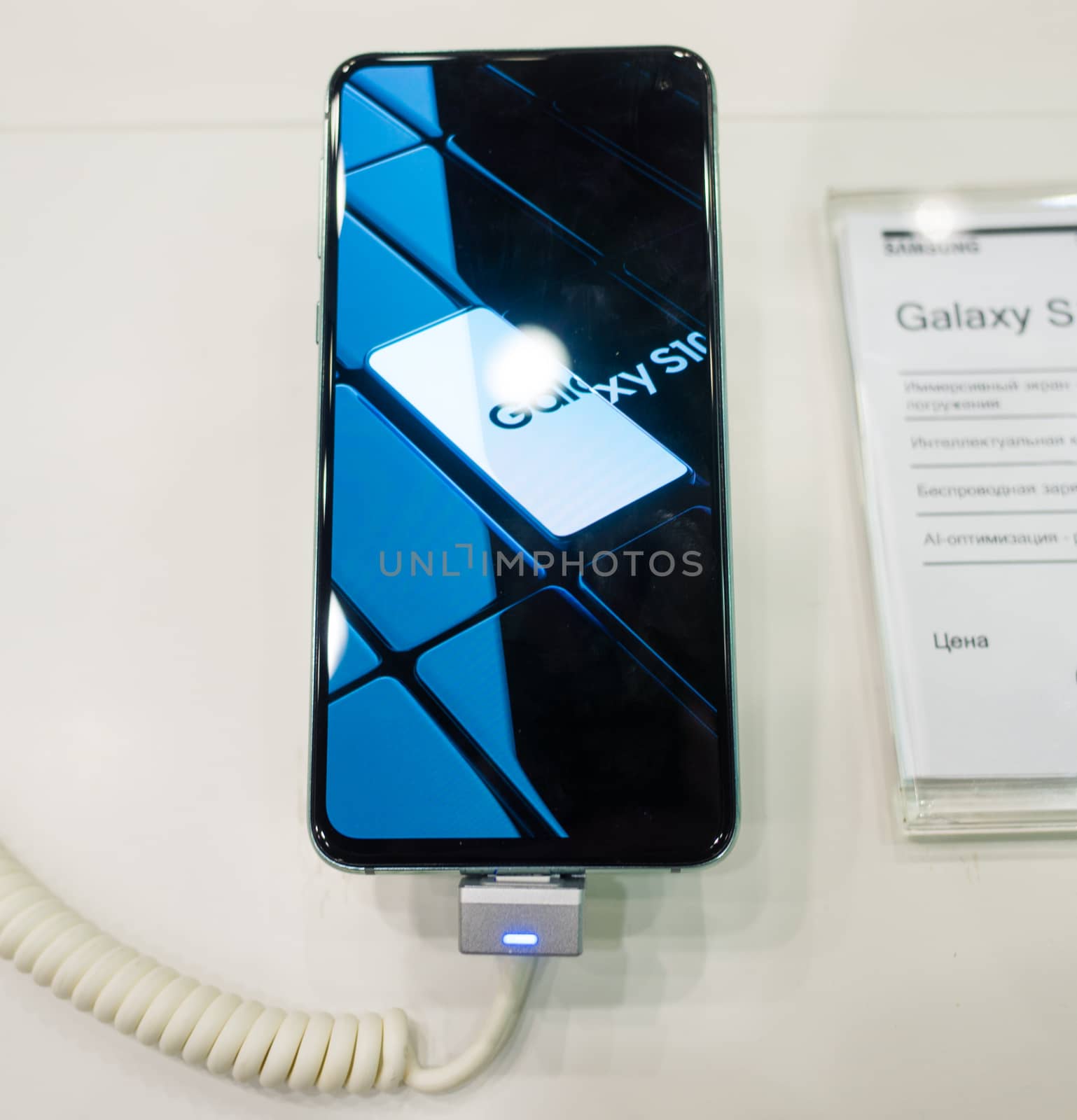 February 28, 2019 Moscow, Russia. The new smartphone from Samsung Galaxy s10e on the shelf in the gadget store.