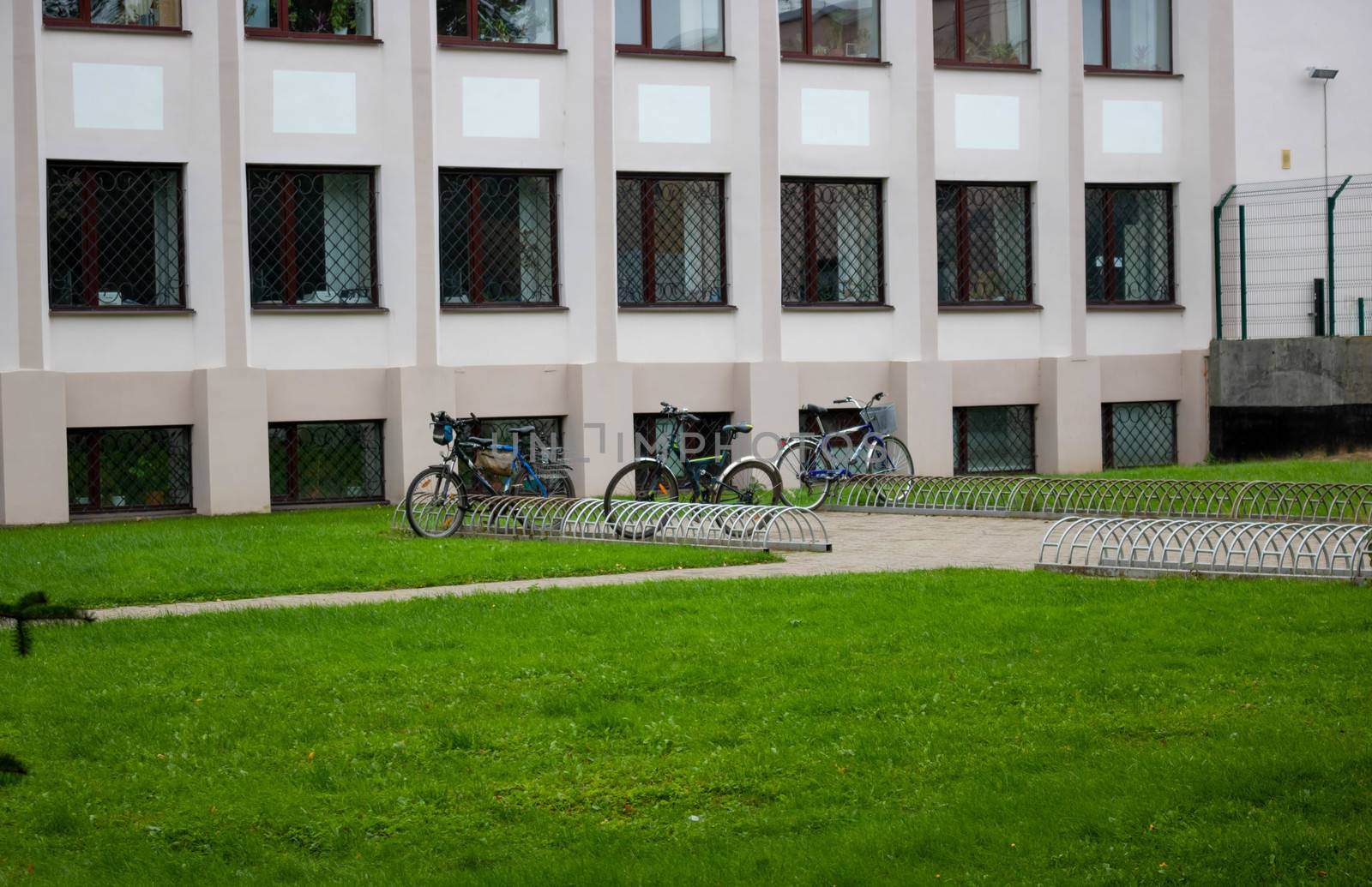 Empty bike Parking racks and three bikes.Transportation. alternative transport.