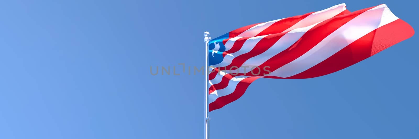 3D rendering of the national flag of Liberia waving in the wind against a blue sky