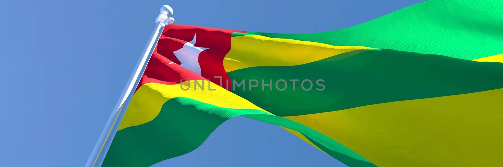 3D rendering of the national flag of Togo waving in the wind against a blue sky