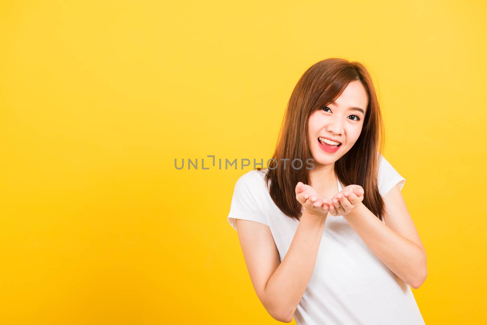 woman teen standing wear t-shirt blowing kiss air something on h by Sorapop