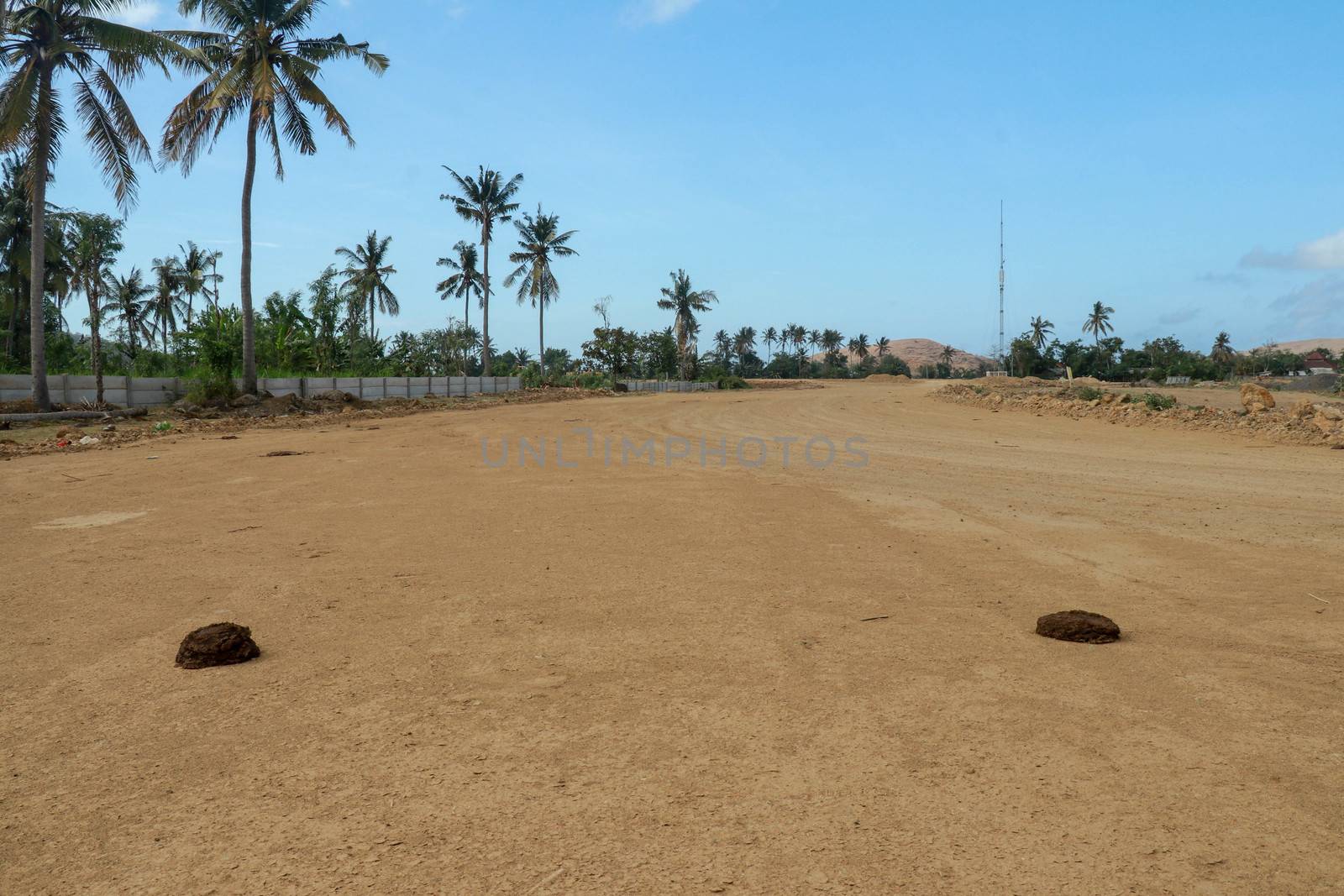 Start position between two cow shit on sand rice circuit. Moto GP Mandalika racing circuit under construction, West Nusa Tenggara, Lombok, IndonesiaRailway under construction.