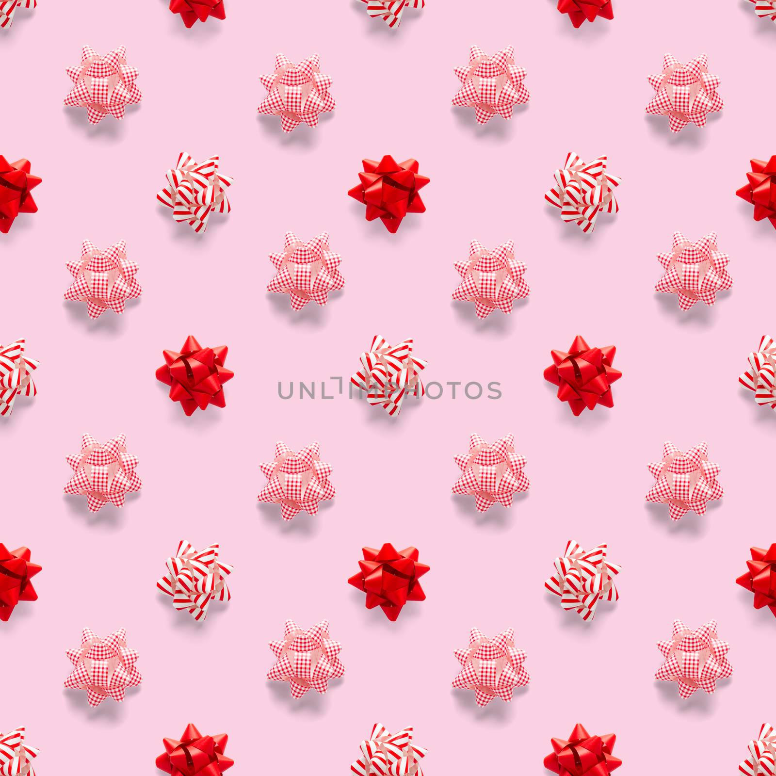 Seamless regular creative Christmas pattern with New Year decorations on pink background. xmas Modern Seamless pattern made from christmas decorations. Photo quality pattern for fabric, prints, wallpapers, banners or creative design works.