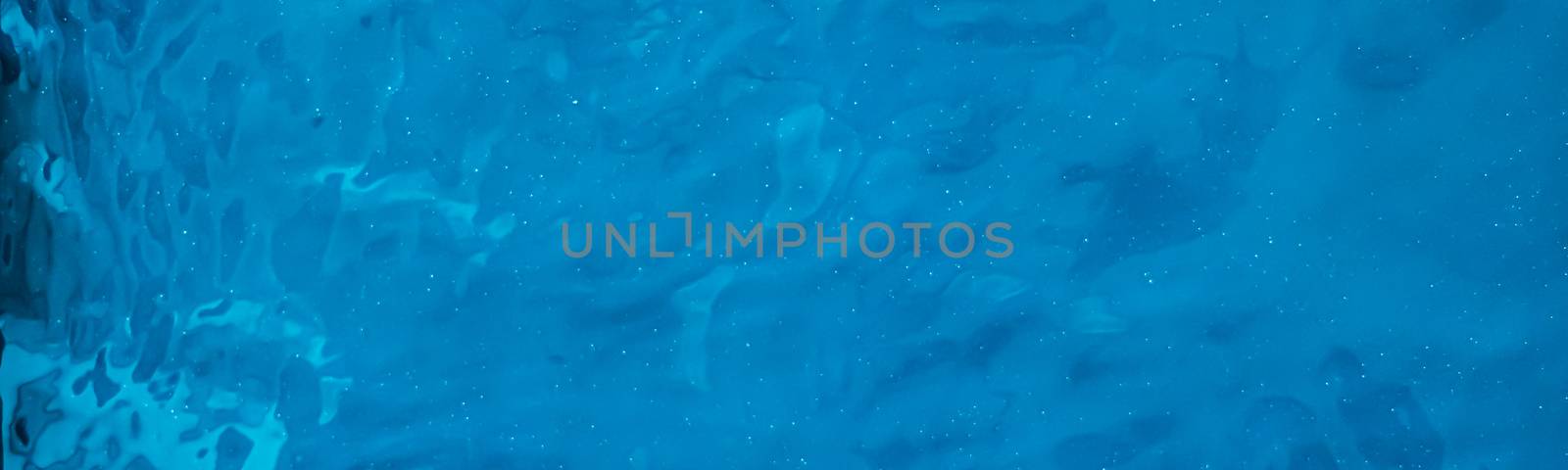 Blue water texture as abstract background, swimming pool and waves designs