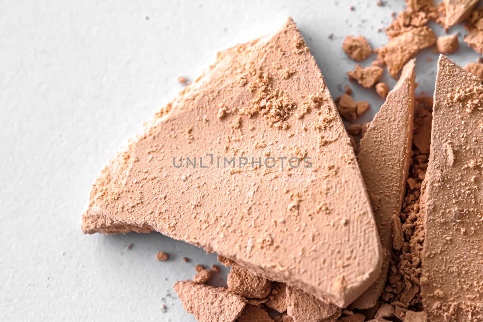 Beige eye shadow powder as makeup palette closeup isolated on white background, crushed cosmetics and beauty texture by Anneleven