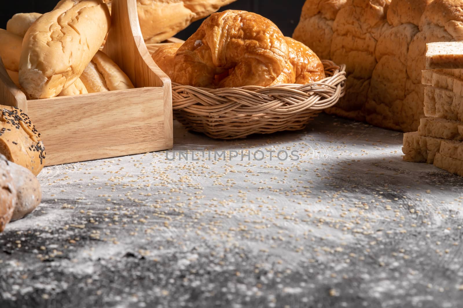 The texture of the wooden black table with sesame background with various bekery.