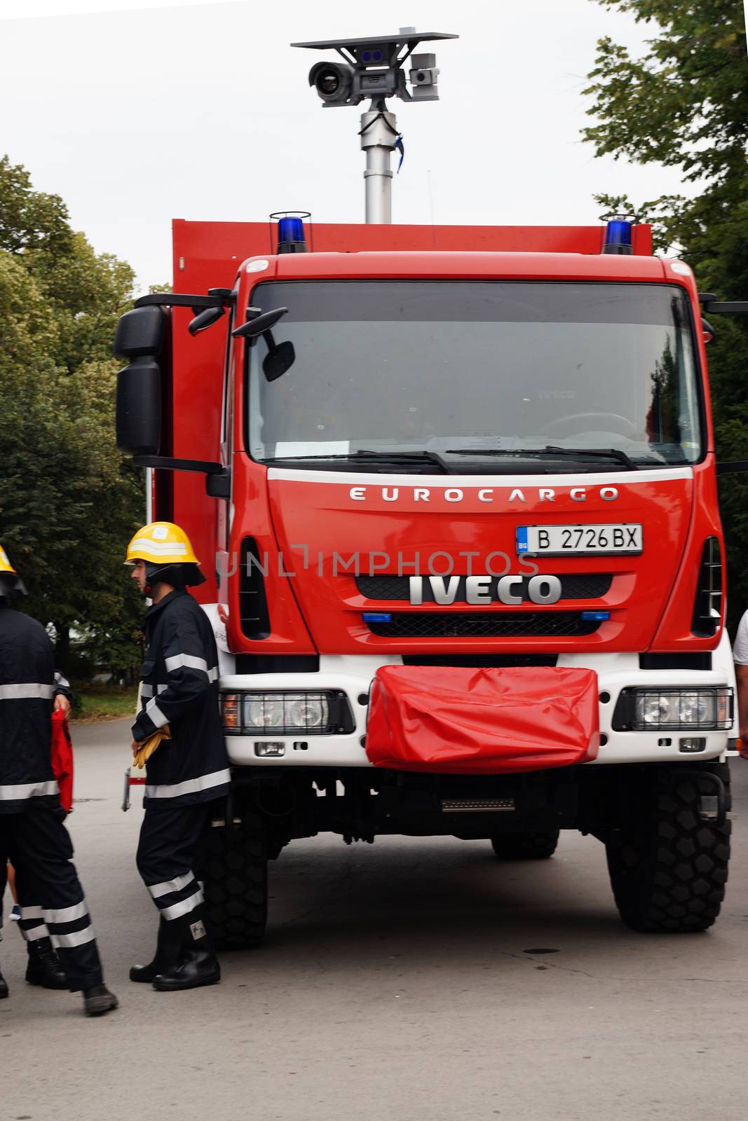 Varna, Bulgaria - September, 13, 2020: firefighters talking near a fire truck with retractable video surveillance system