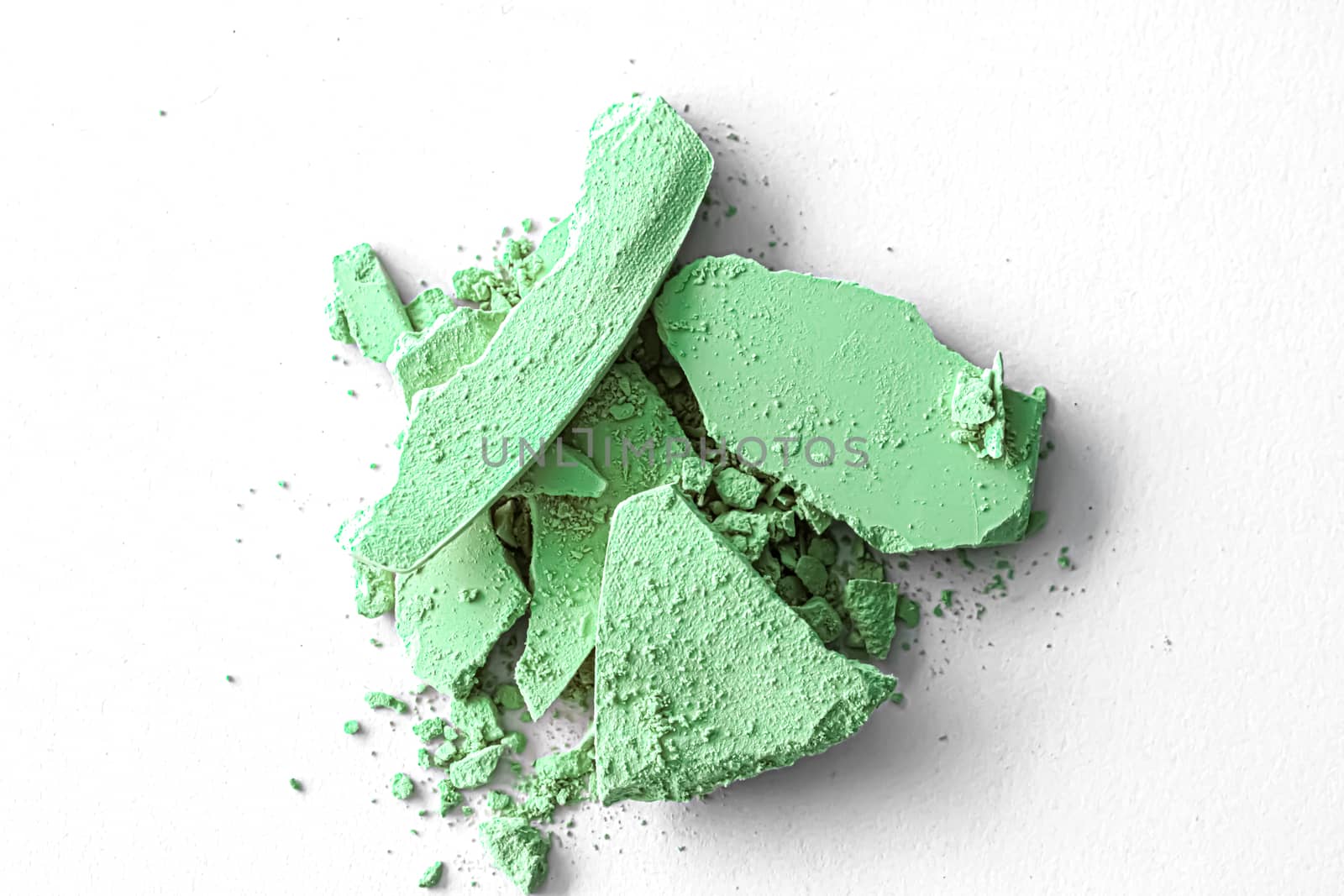Green eye shadow powder as makeup palette closeup isolated on white background, crushed cosmetics and beauty texture by Anneleven