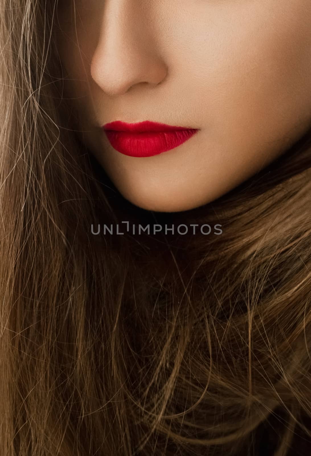 Glamorous beauty face closeup of a woman with classy makeup look and bright lipstick, brunette girl with long hair, female model posing, luxury cosmetics or luxe skincare brand by Anneleven