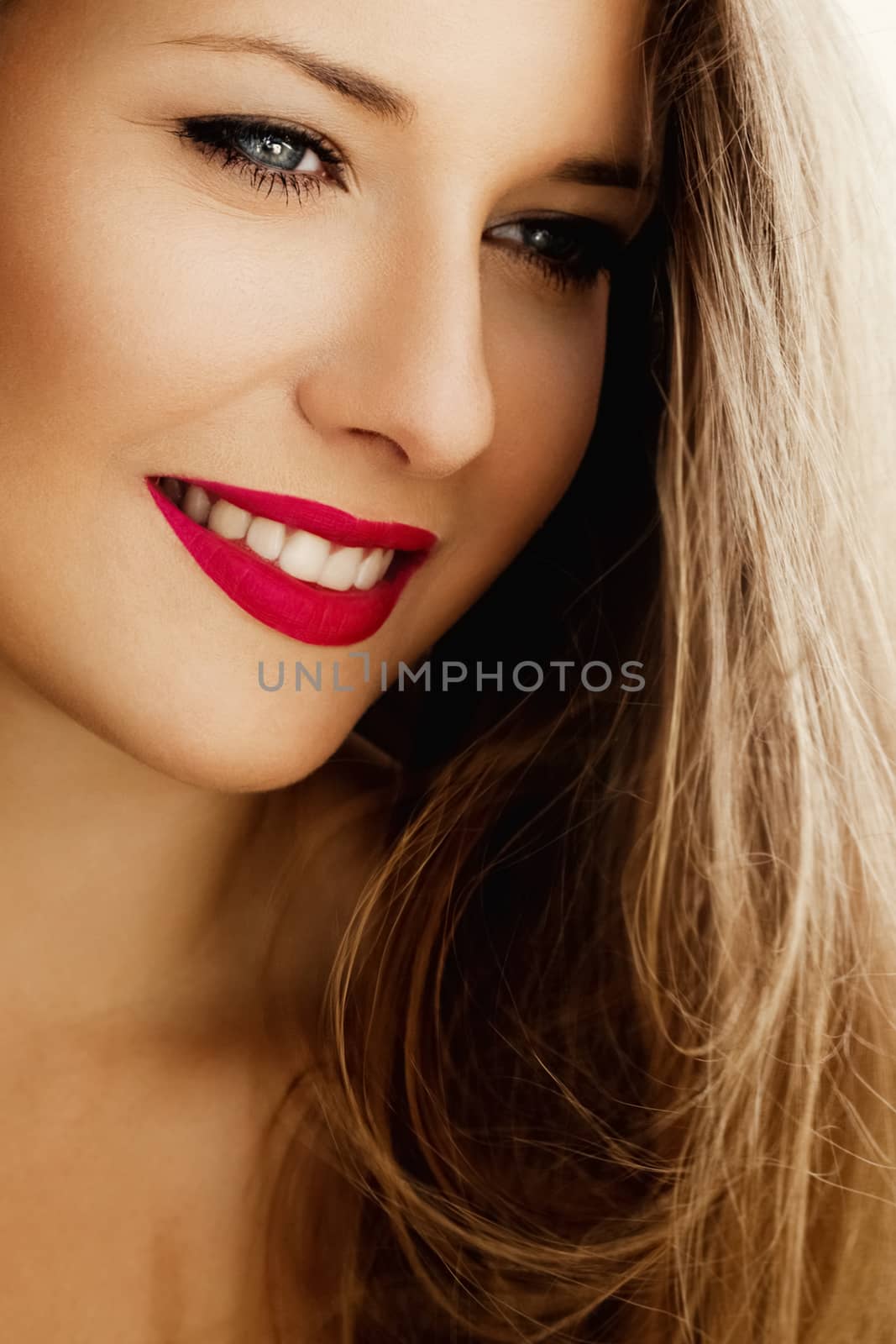 Happy woman smiling, brunette with long light brown hair, natural makeup look, female showing healthy white teeth, beauty portrait for cosmetic or lifestyle brands